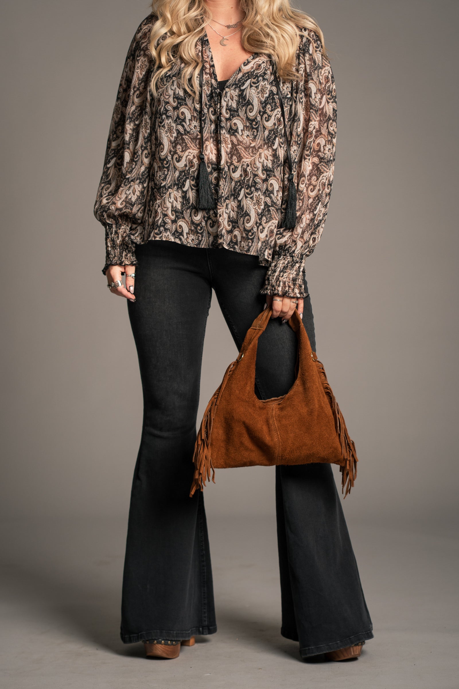 Little Lies Lila tan suede fringed grab bag – full length on model showing silhouette and fringe movement
