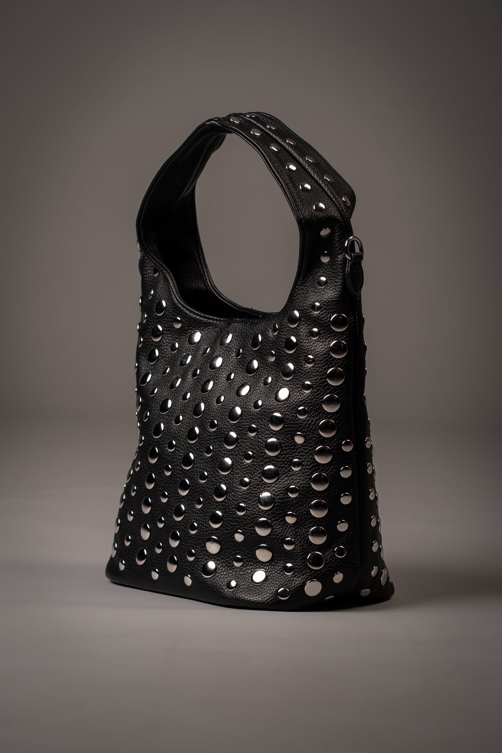 Little Lies Viva Black Studded Hobo bag with silver-tone hardware, photographed in a studio setting