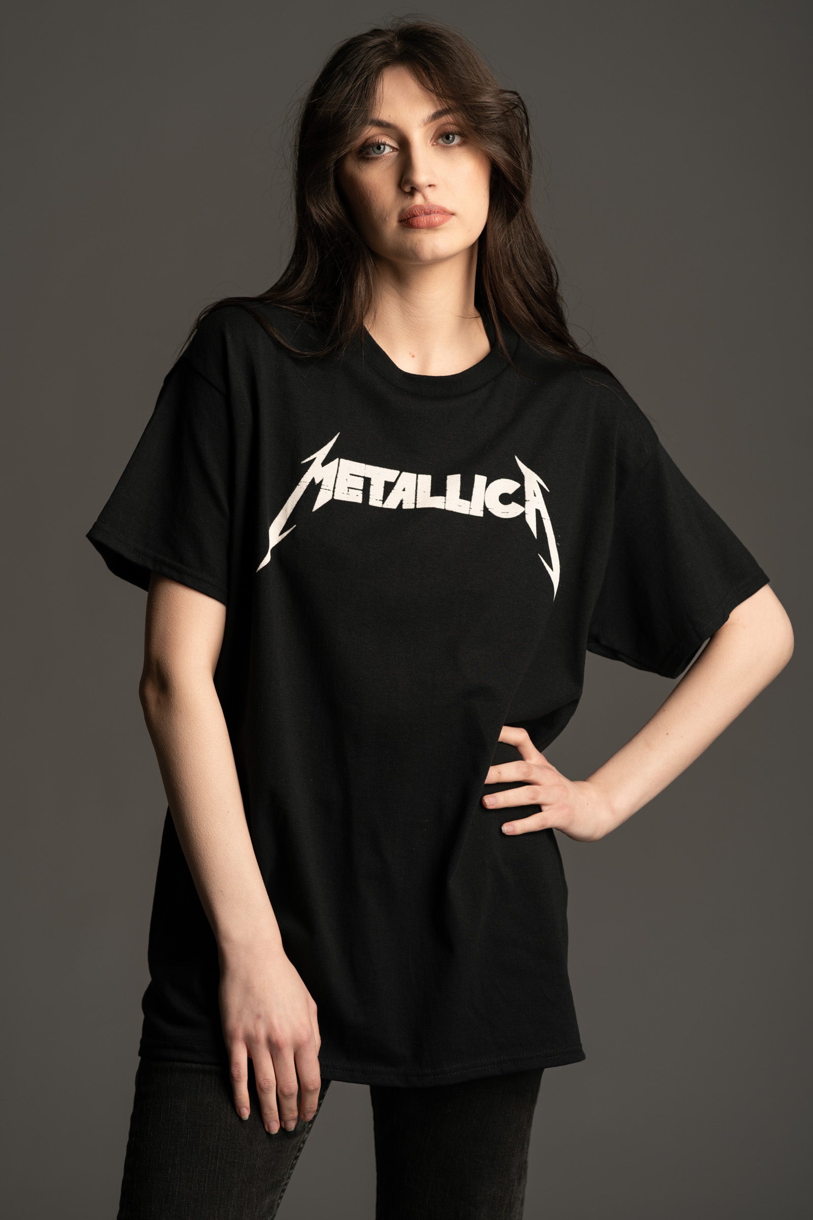 Andie wears Little Lies oversized Metallica Master Of Puppets graphic T‑shirt with bold white logo on the front.