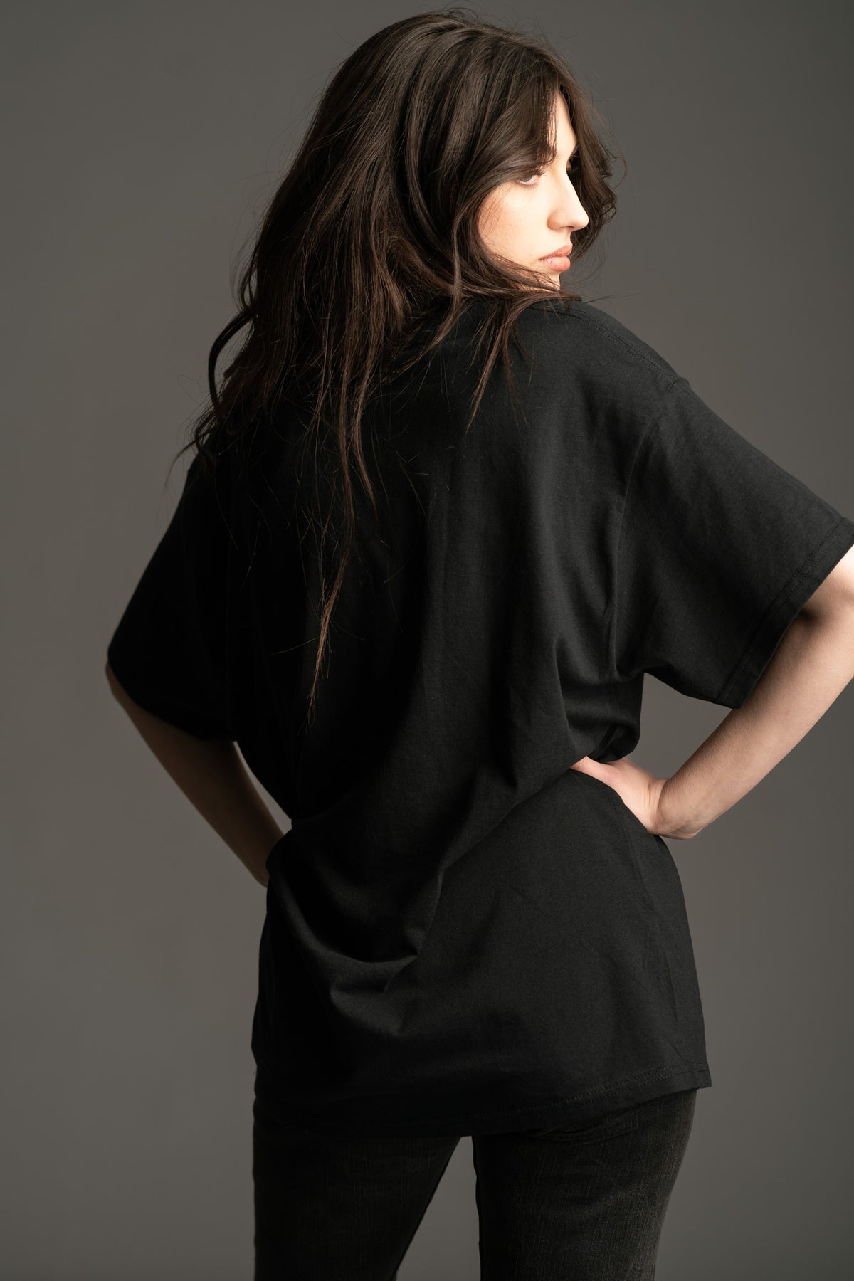 Back view of Motorhead Snake Band Tee styled with flares from Little Lies