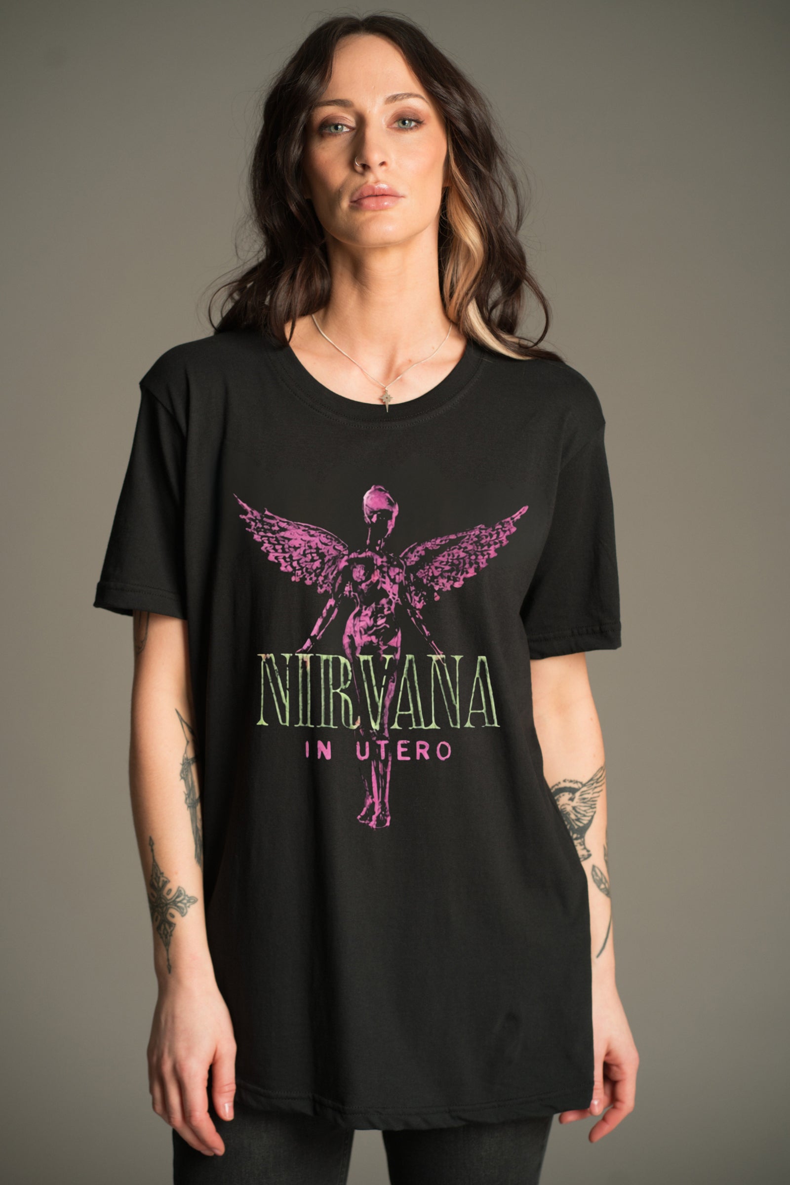 Nirvana In Utero pink graphic band tee worn on model and styled with Hendrix Denim Flares