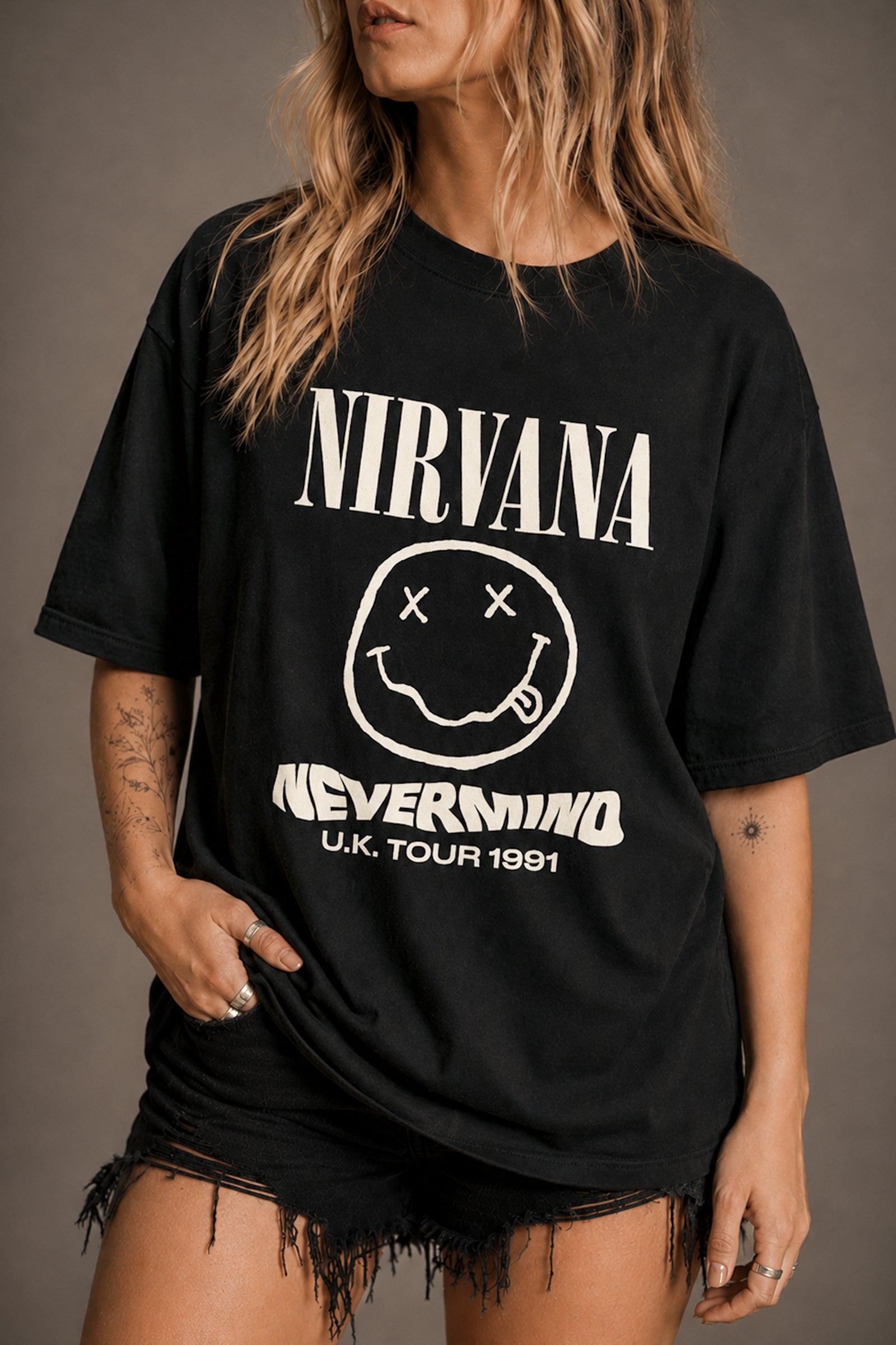 Little Lies Nirvana graphic t-shirt in black featuring Nevermind UK tour 1991 print with smiley face logo
