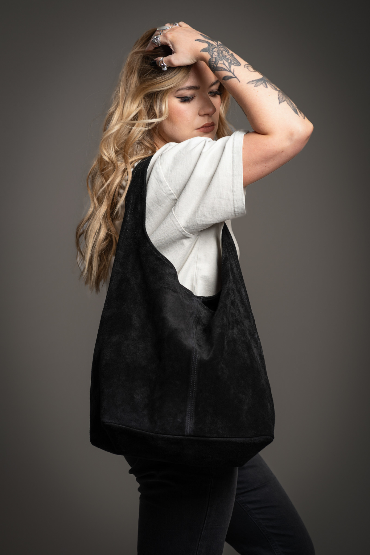 Erin wearing the Olsen Black Slouchy Suede Bag