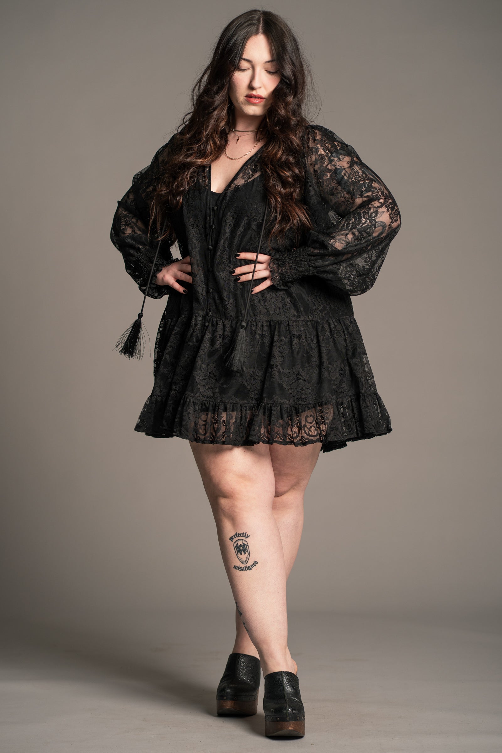 Side view of Little Lies Rhiannon Black Lace Smock Dress showing trapeze mini silhouette and lace fabric