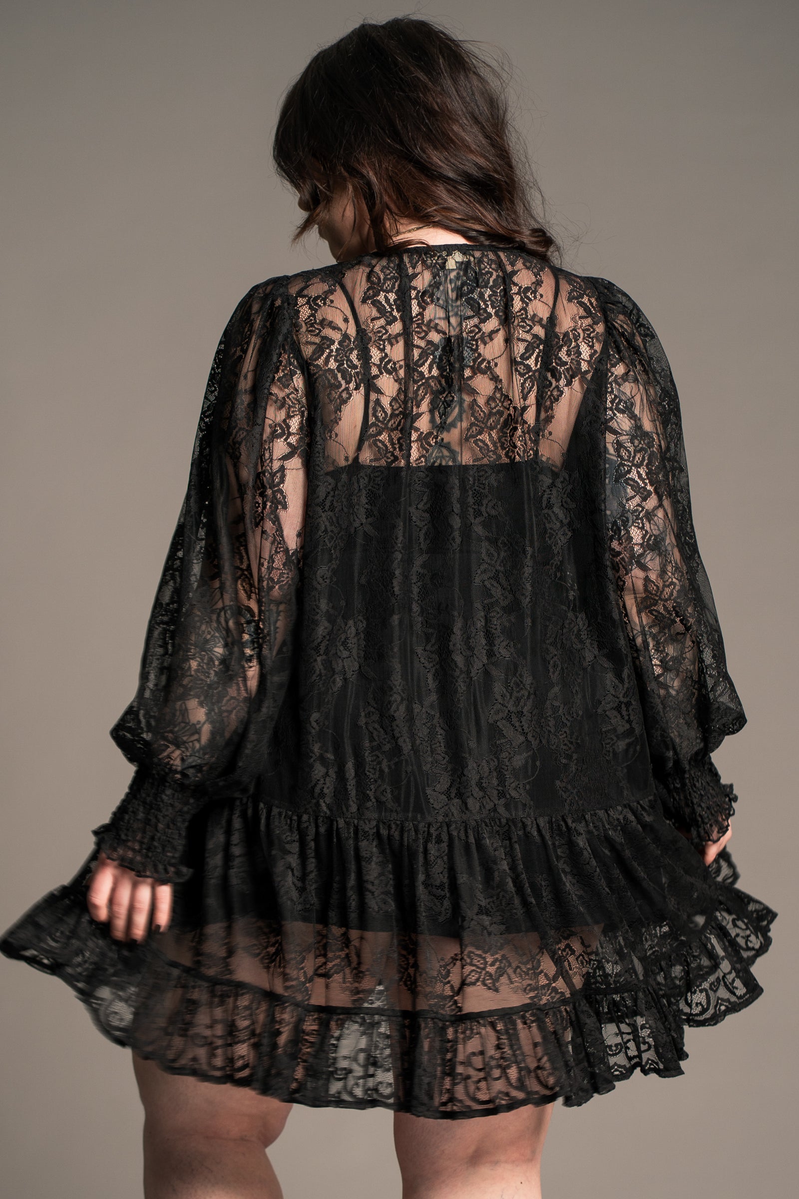 Back view of Little Lies Rhiannon Black Lace Smock Dress showing billowing sleeves and tiered skirt
