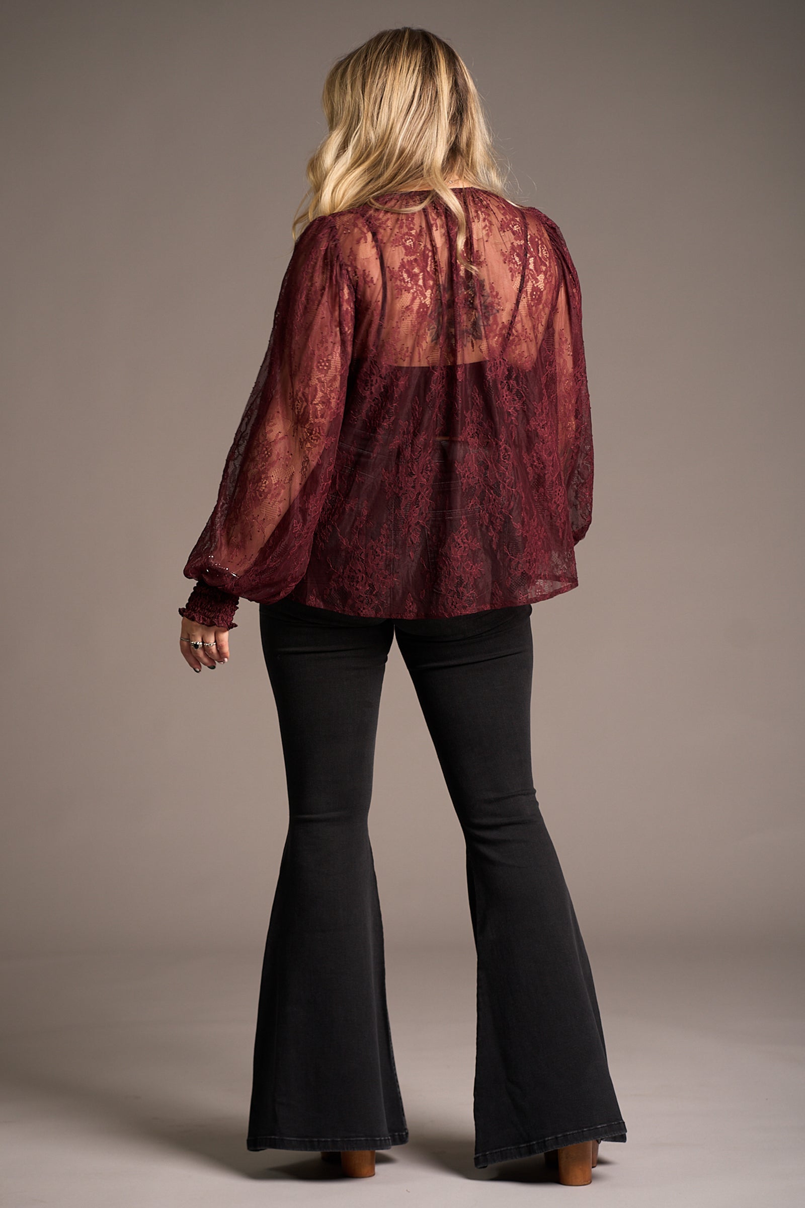 Erin showing the back of the Rhiannon Burgundy Lace Smock Top, Stevie Nicks inspired styling studio