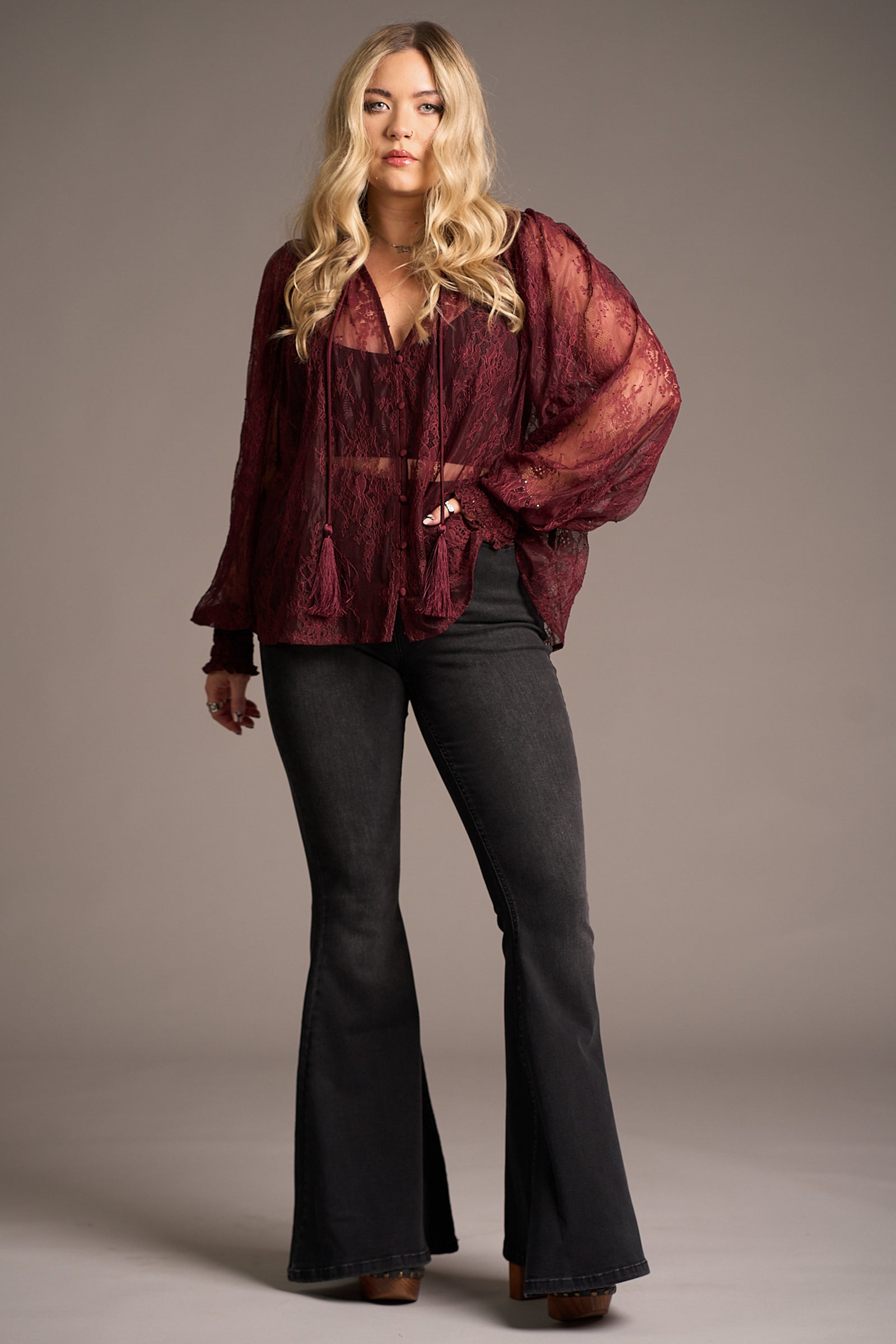 Erin wears Rhiannon Burgundy Lace Smock Top over flared jeans, Stevie Nicks inspired styling studio