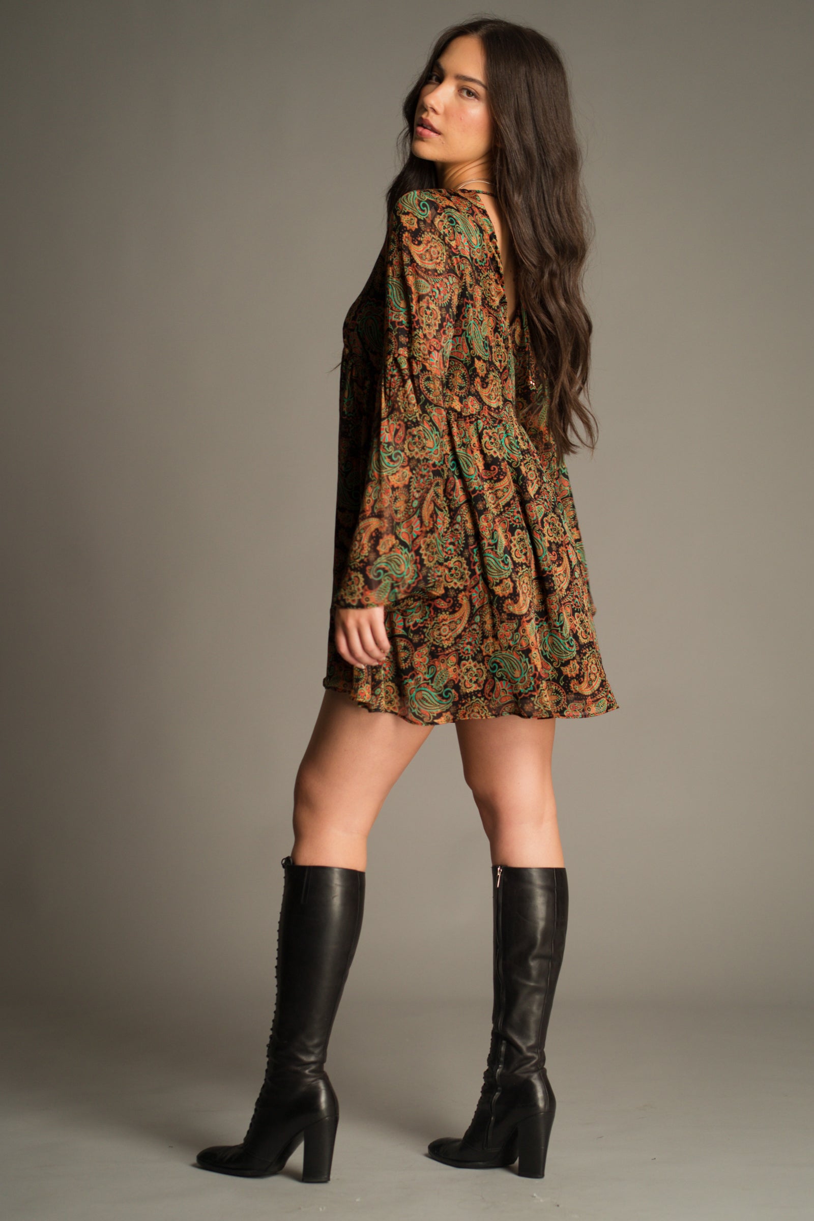 Side view of the Ringo Paisley Smock Dress featuring a relaxed swing silhouette, statement bell sleeves and vintage-inspired paisley pattern