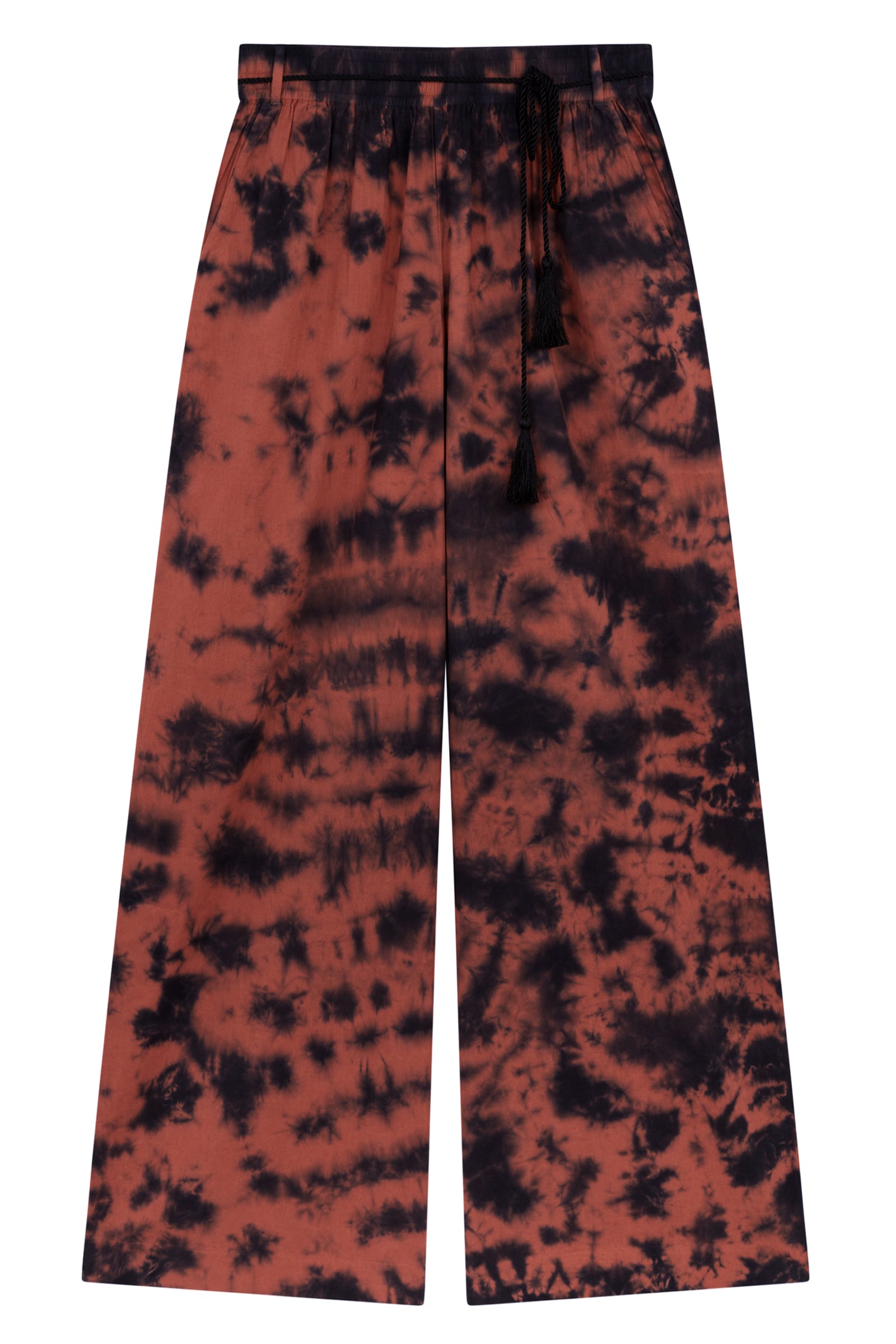 Little Lies Zephyr Tie Dye Co-Ord trousers, a vibrant tie-dye wide leg design with a black tie waist cord and pockets. Laid flat on a white background.