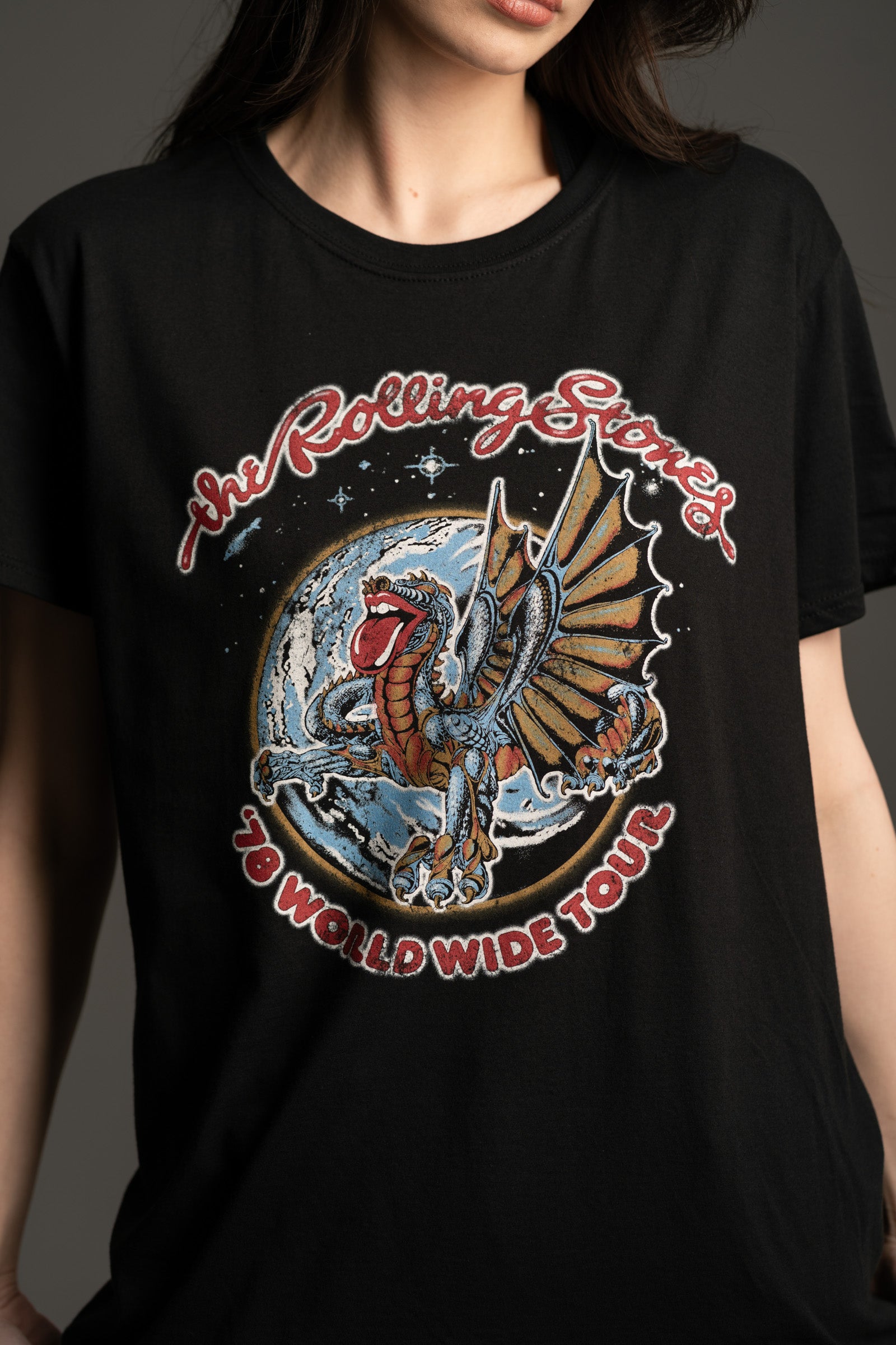 Close up of Little Lies black Rolling Stones Dragon Band Tee with world tour style print
