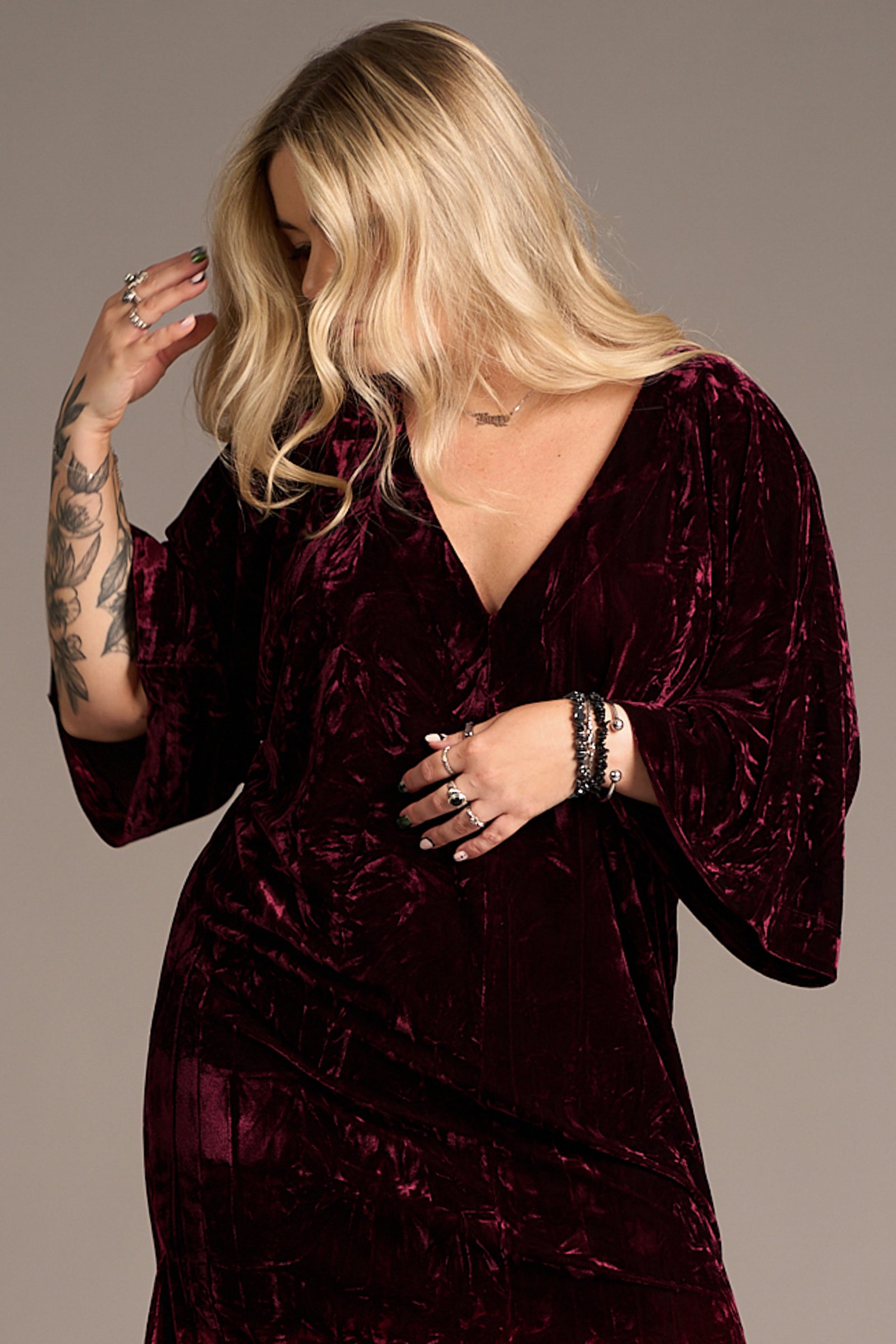 Close up of Erin showcasing the Rumours Merlot Velvet Midi Dress
in rich burgundy velvet with V-neckline