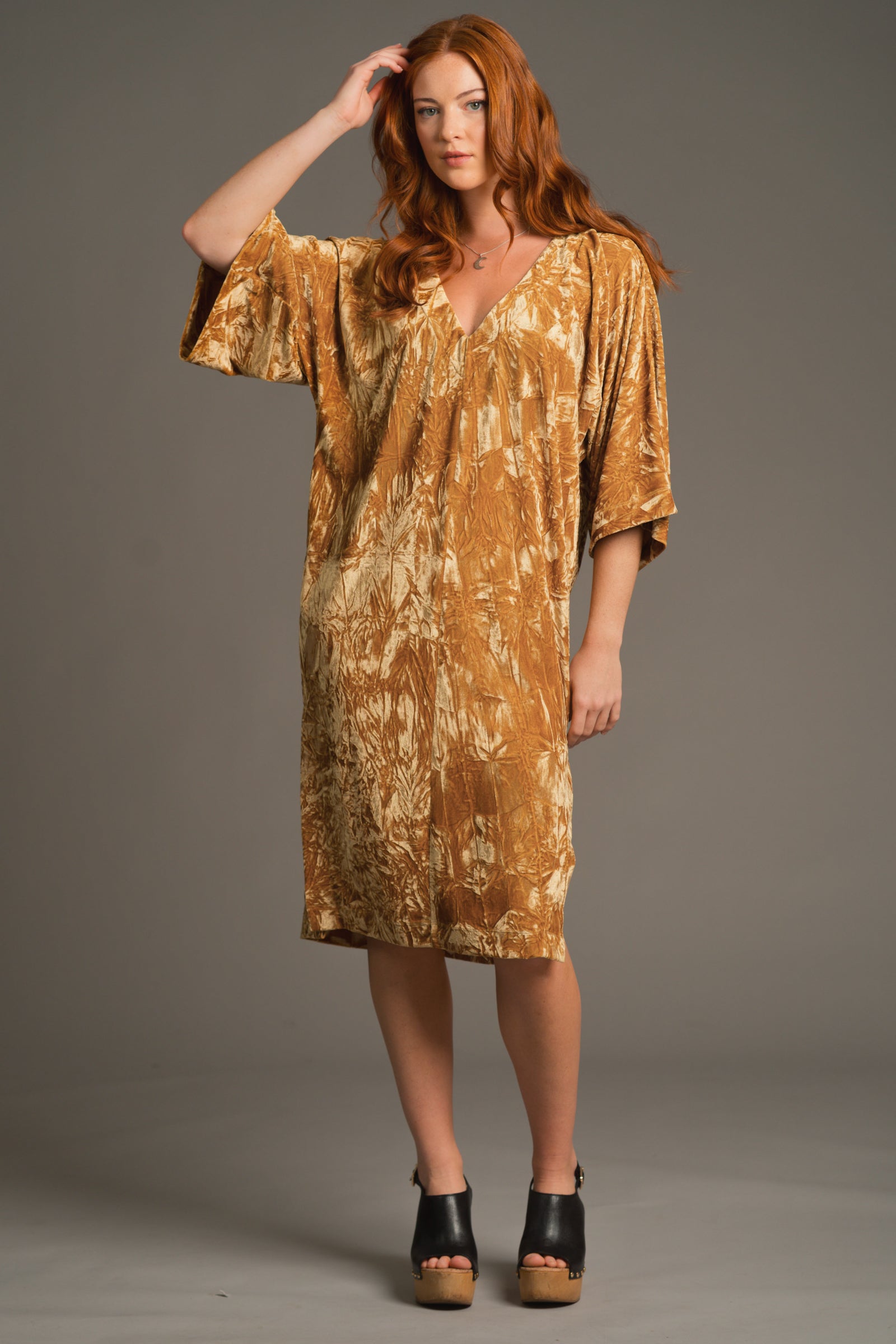 Front view of model wearing Rumours ochre crushed velvet midi dress with kimono sleeves