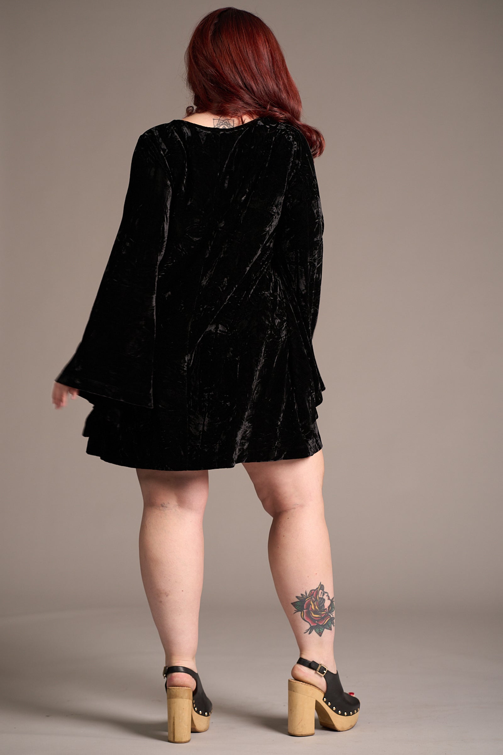 Taylor showing the back of the Sara Black Velvet Mini Dress. Stevie Nicks inspired styling studio