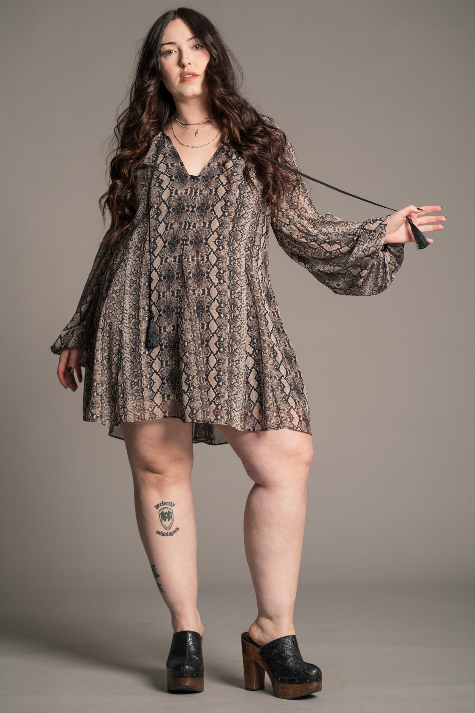 On-model: Little Lies Seeker snake mini dress, on-model front view