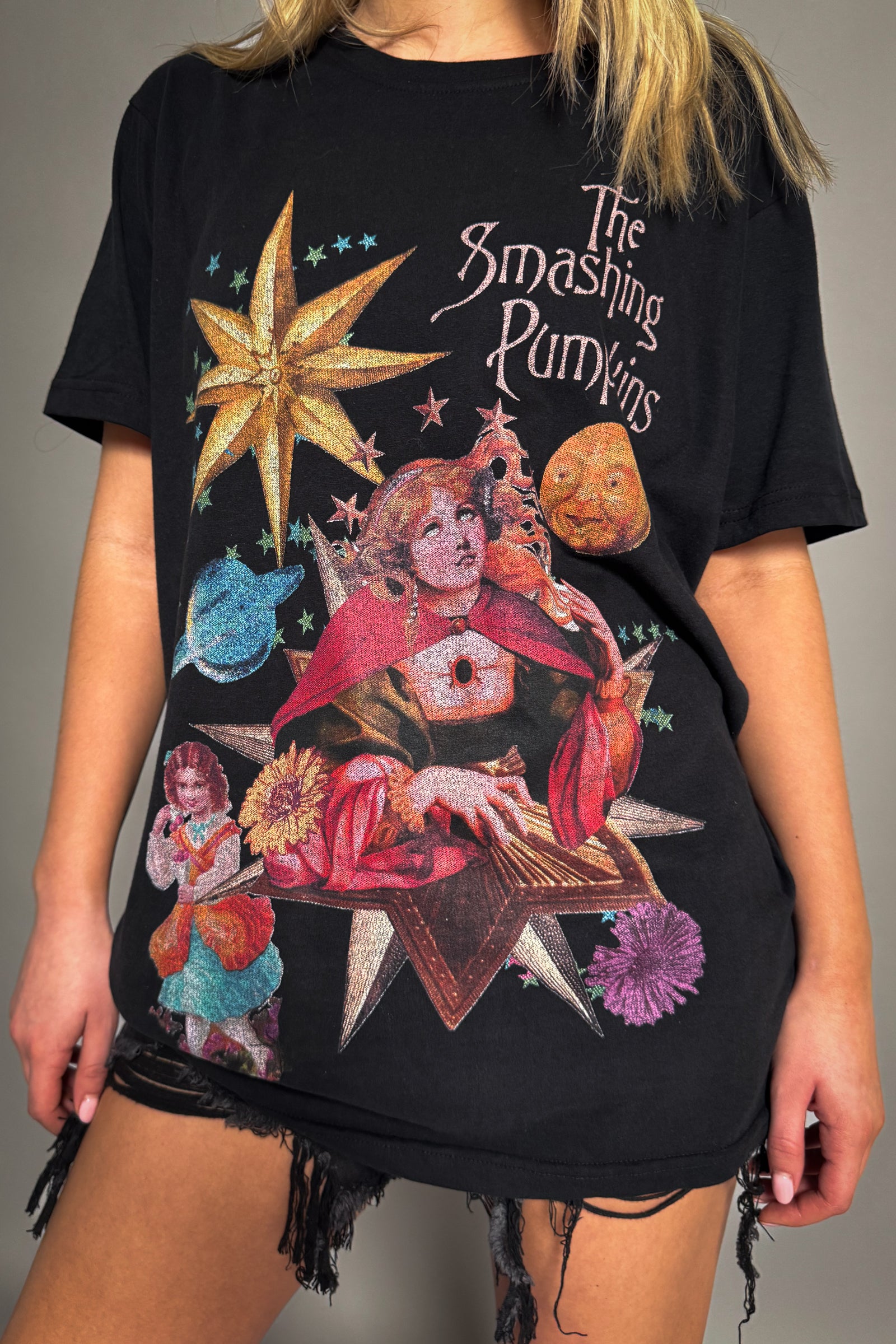 Little Lies The Smashing Pumpkins celestial band tee in black with colourful star, planet and character graphic from Mellon Collie tour and relaxed fit