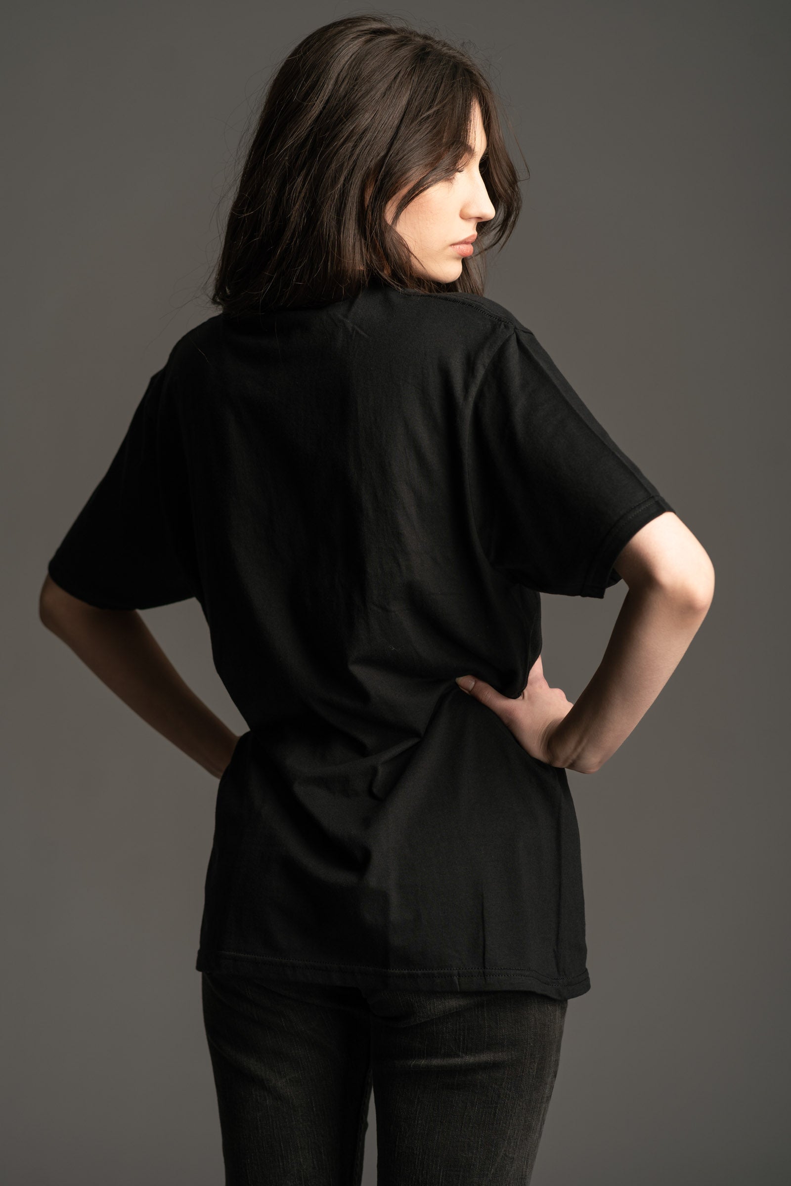 Back view of Andie wearing Little Lies The Doors People Are Strange black graphic t-shirt