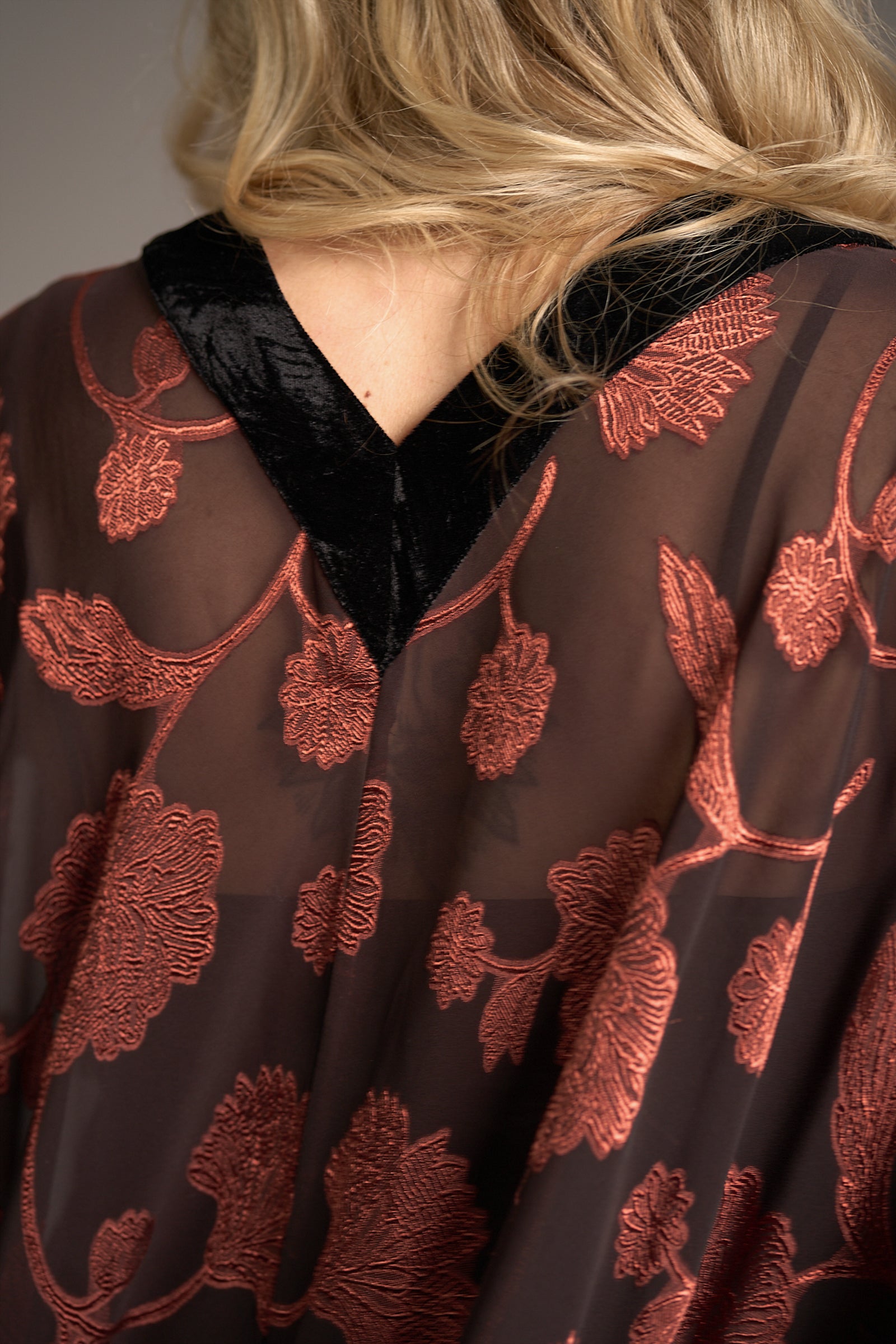 Erin wearing the Venus Fringed Kimono, fabric detail shot showing velvet trim detail along neckline