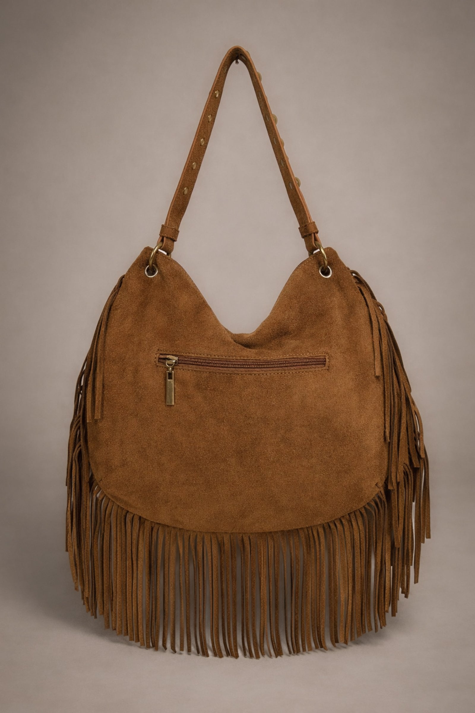 Little Lies Willow Slouchy tan faux suede bag back view with zip pocket and fringe detail in studio setting.