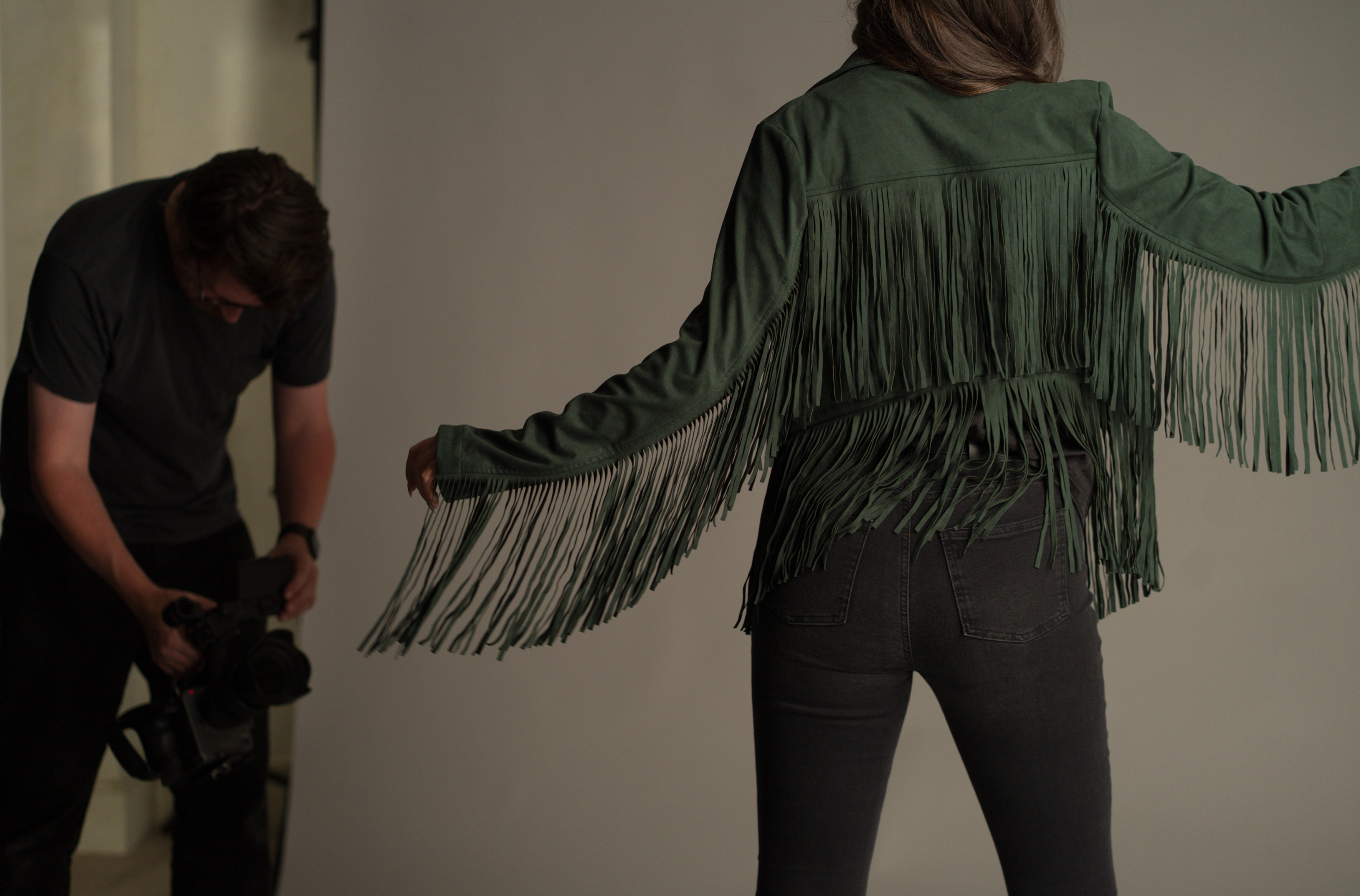 Behind the scenes of the Little Lies autumn campaign featuring the Ivy Fringed Faux Suede Jacket with statement western-inspired fringe detailing and soft faux suede fabric.