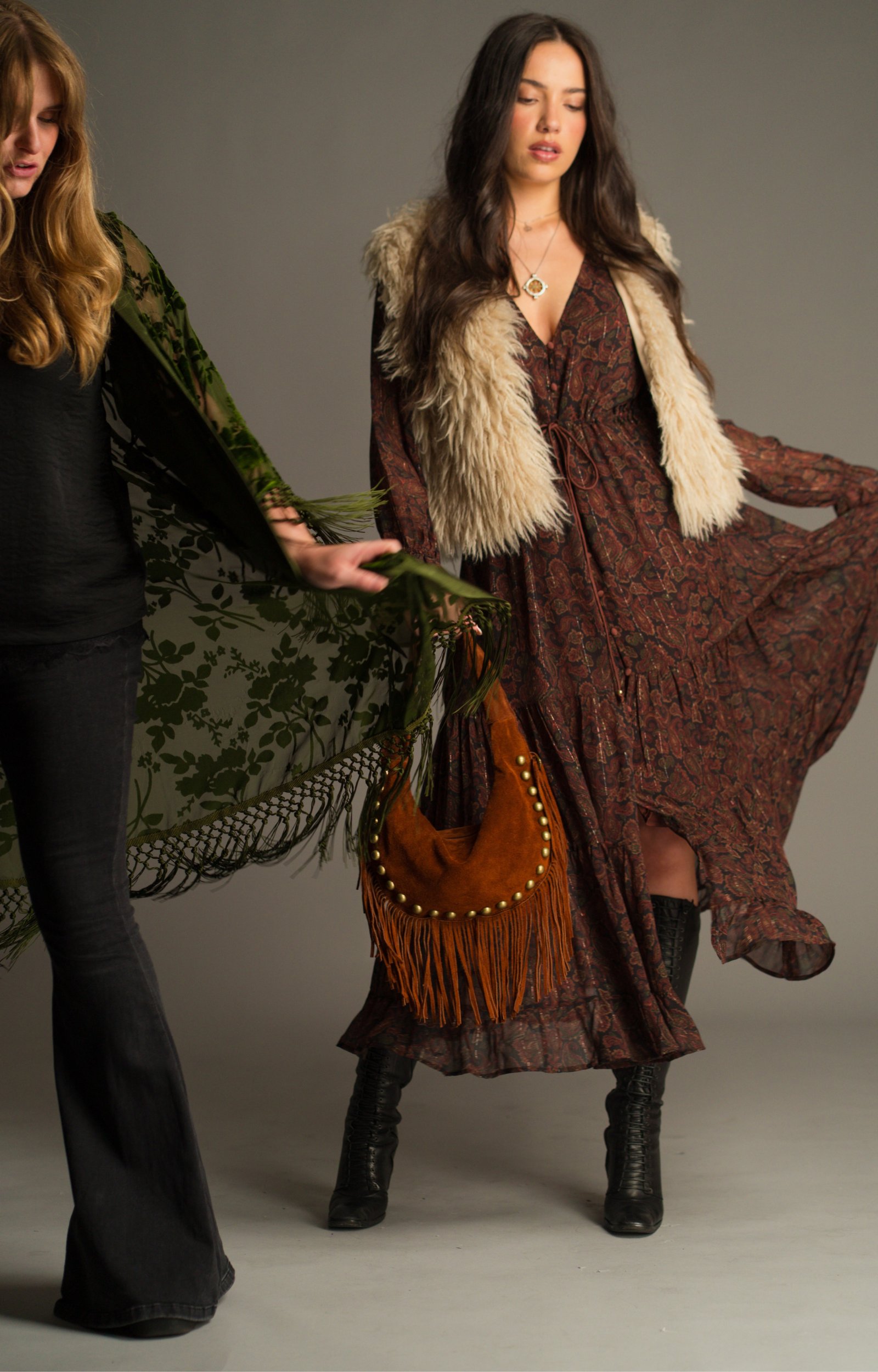Dark Paradise Paisley Maxi Dress by Little Lies styled for the autumn campaign with a faux fur gilet, suede fringe bag and flowing boho silhouette