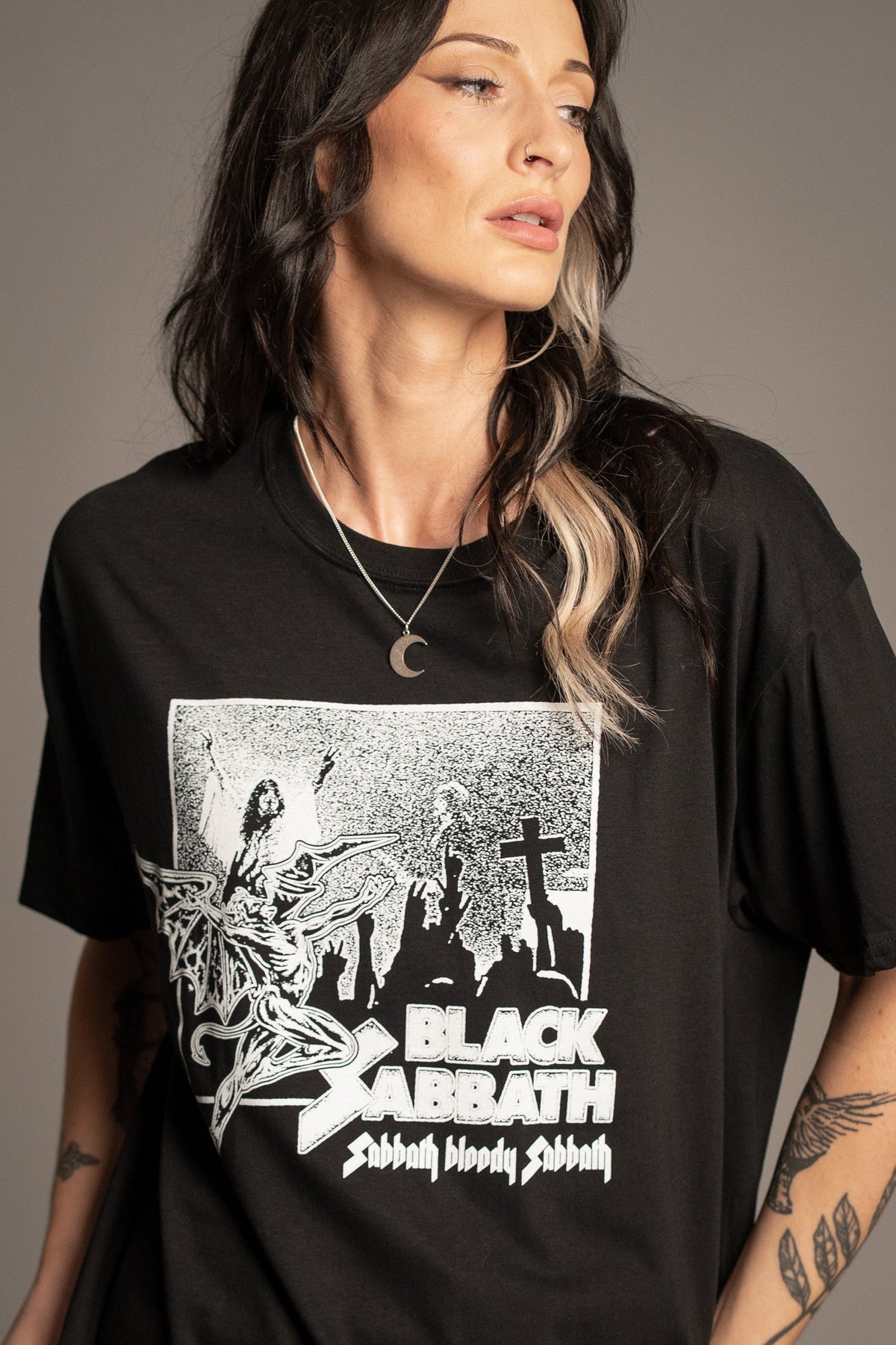 Close-up of Victoria wearing the Black Sabbath Bloody Sabbath band T-shirt with monochrome album artwork