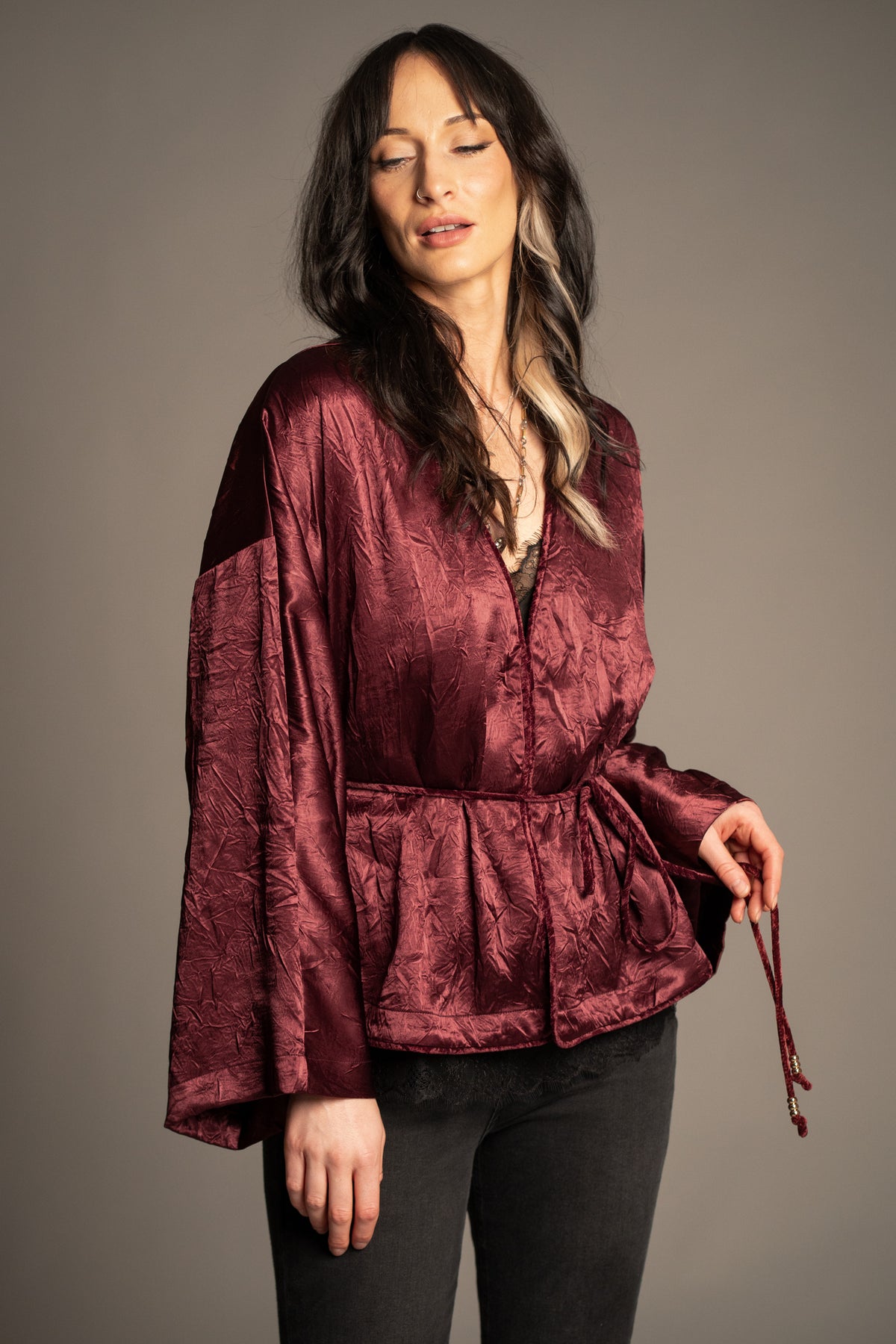 Celeste wine kimono top with hook and eye front closure design, velvet piping detail, beaded tie waist and wide kimono sleeves front view