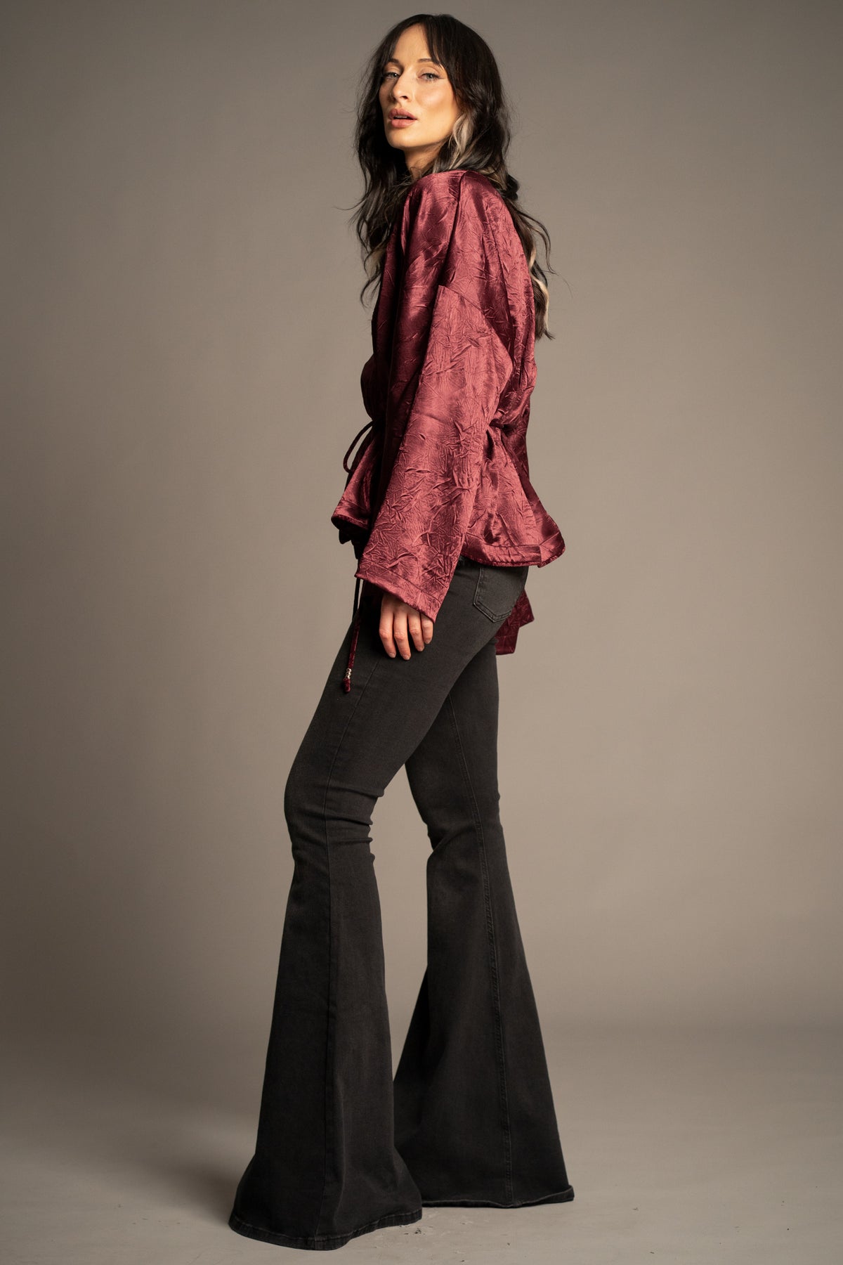 Celeste wine kimono top side view featuring draped kimono sleeves, tie waist detail and flowing silhouette