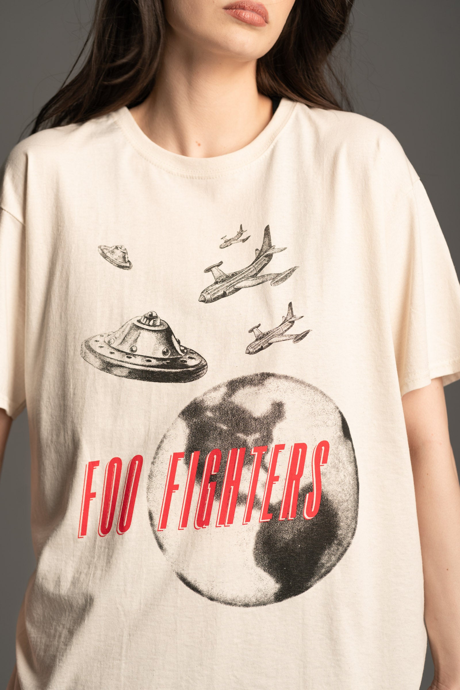 Close-up of UFO graphic on cream Foo Fighters band tee from Little Lies
