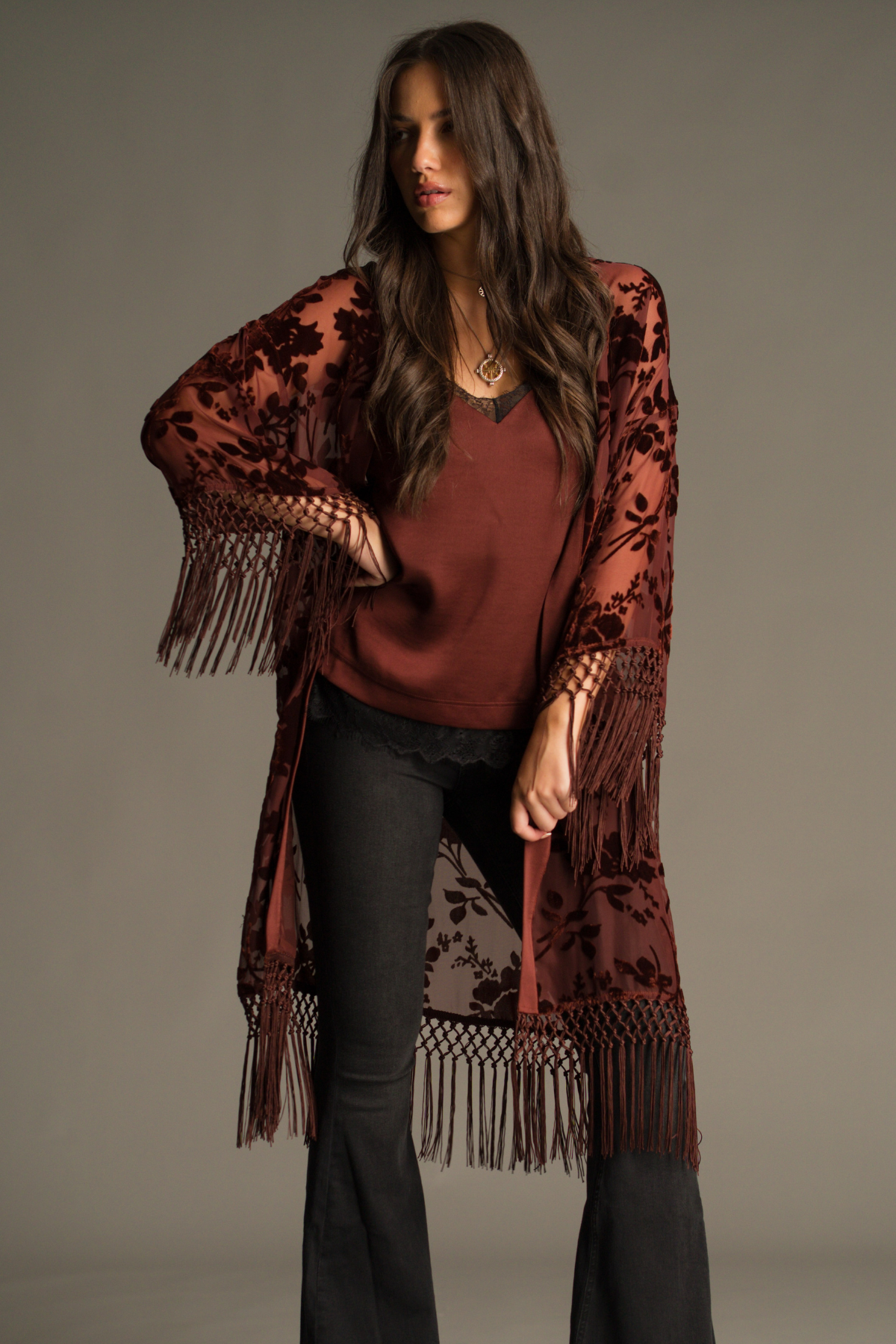 Dakota Rust Devore Kimono by Little Lies layered over the Nightbird Rust Satin Cami Top, featuring burnout velvet detailing, fringe trim and rich autumnal tones