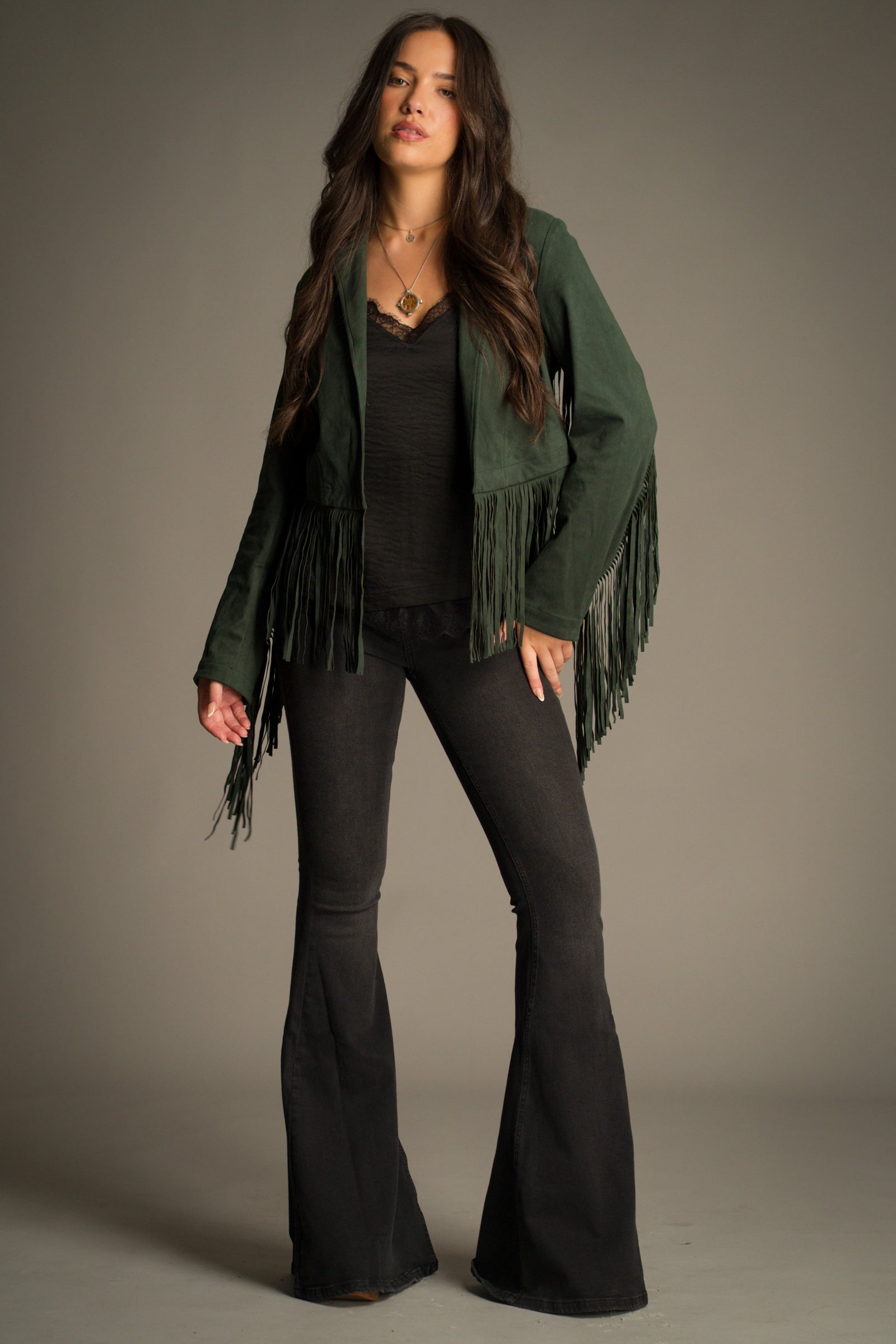 Full frontal view of the Ivy Emerald Green Fringed Faux Suede Jacket showing open blazer front and dramatic fringing.