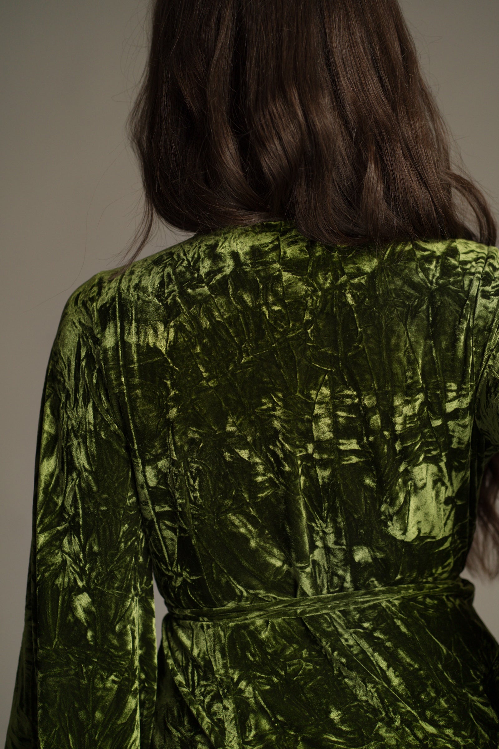 Back neck detail view of Jaded Olive Crushed Velvet Wrap Mini Dress.