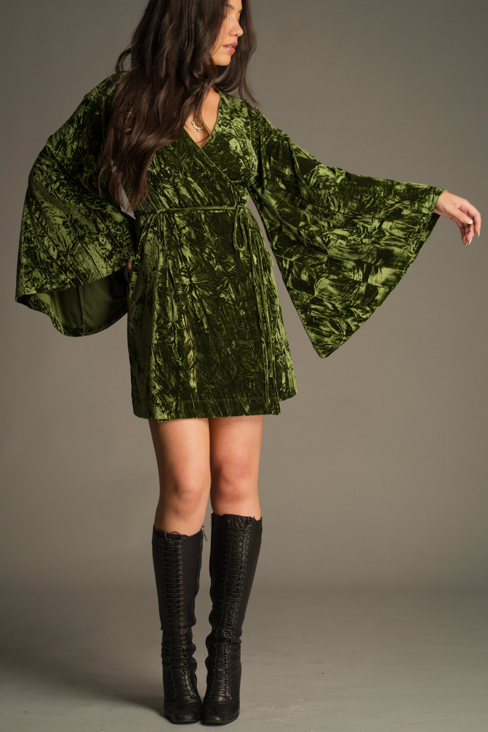 Jaded Olive Crushed Velvet Wrap Mini Dress showing flared sleeve detail. 