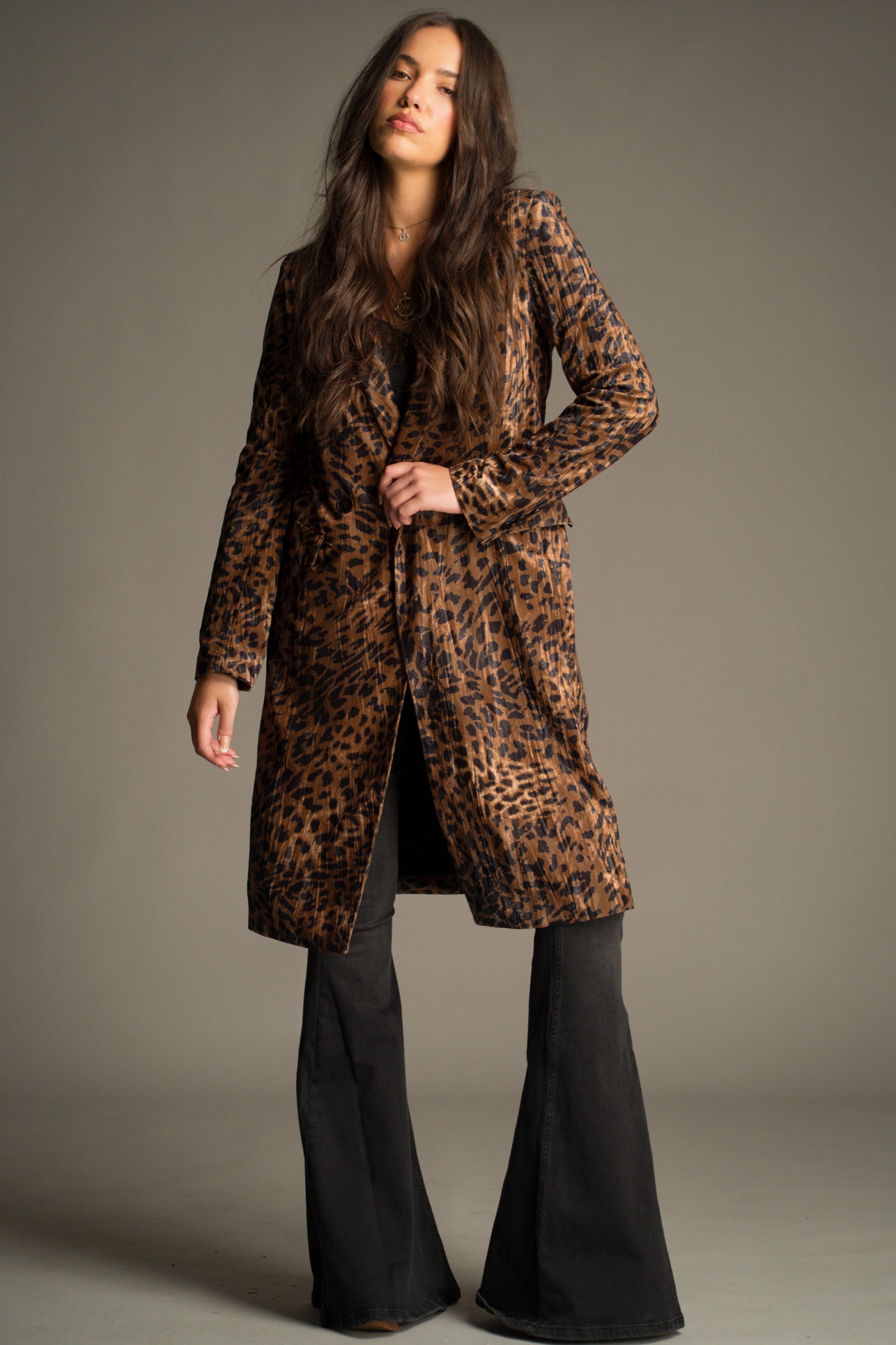 Front view of the Jagger Leopard Velvet Duster Coat in rich vintage-inspired leopard print velvet. Styled with Hendrix Denim Flares.