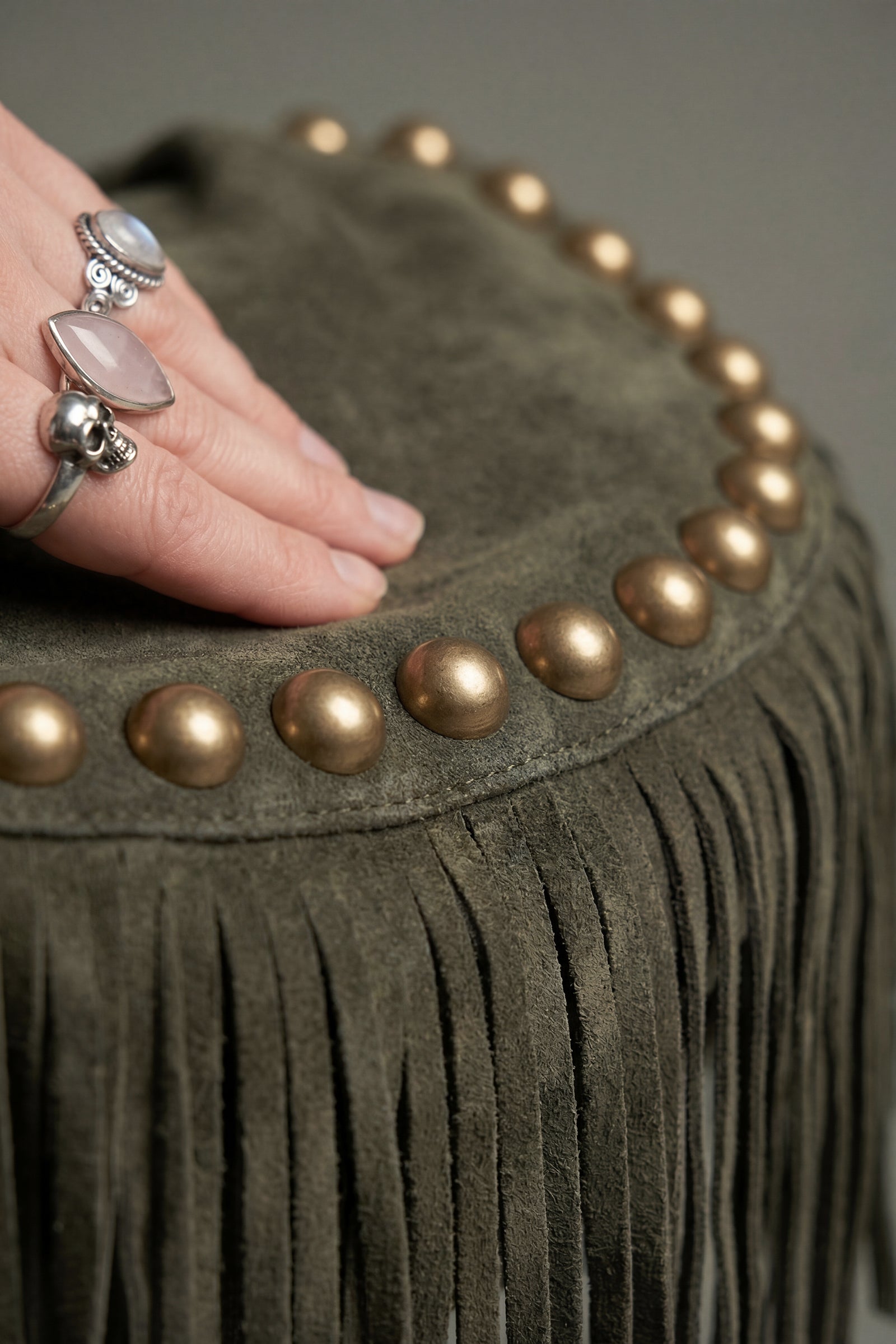 Studded detail and fringe on Kate khaki suede slouchy bag