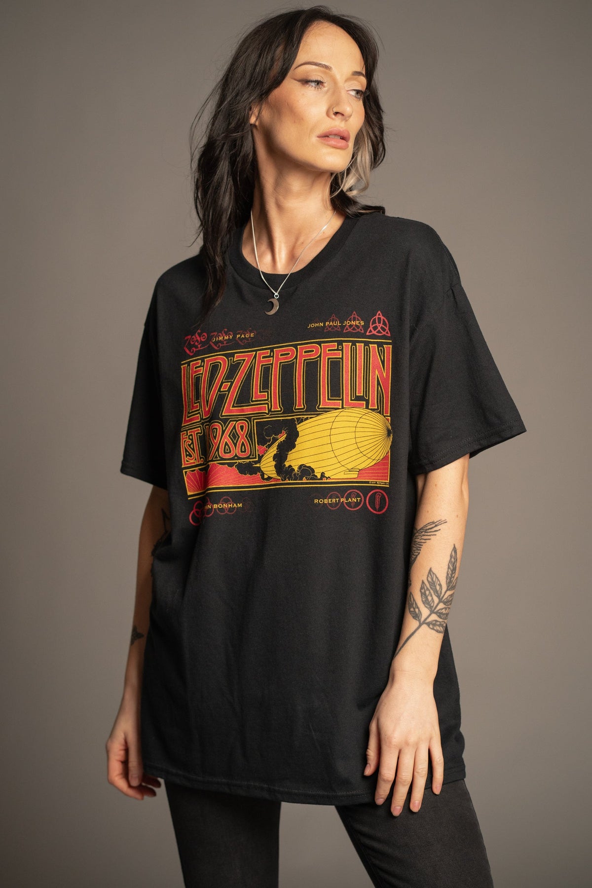 Victoria wearing the Led Zeppelin 1968 black band T-shirt sized up for an oversized look, front view