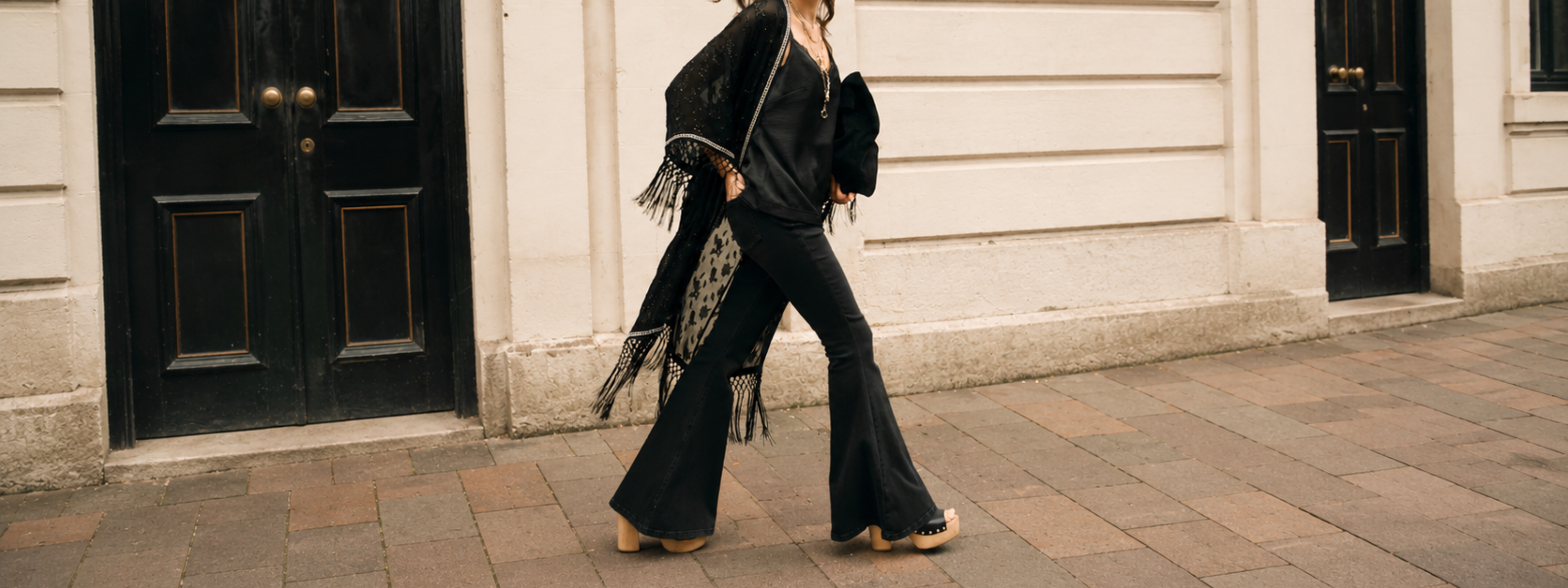 Little Lies Electric Lady Studded Kimono in black metallic jacquard with fringe trim worn over Hendrix Denim Flares