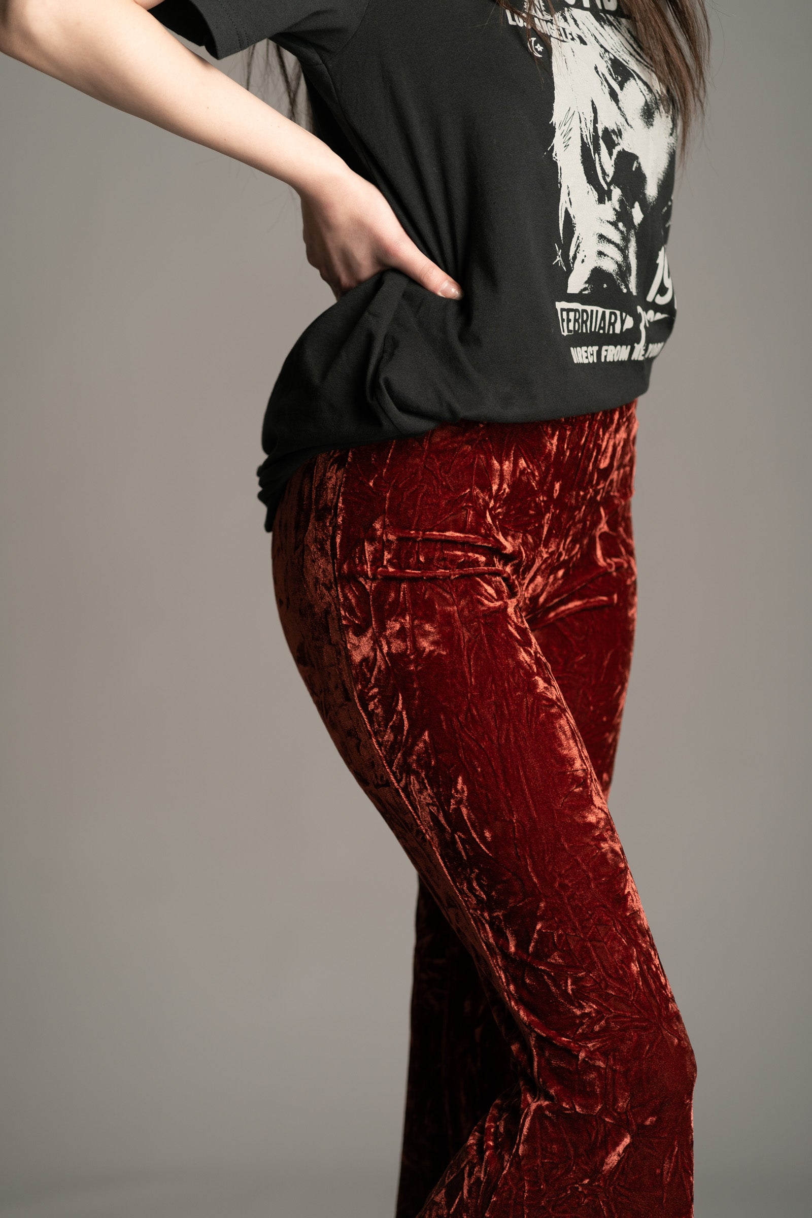 Side view of Hendrix Rust Crushed Velvet Flares showing wide bell-bottom flare