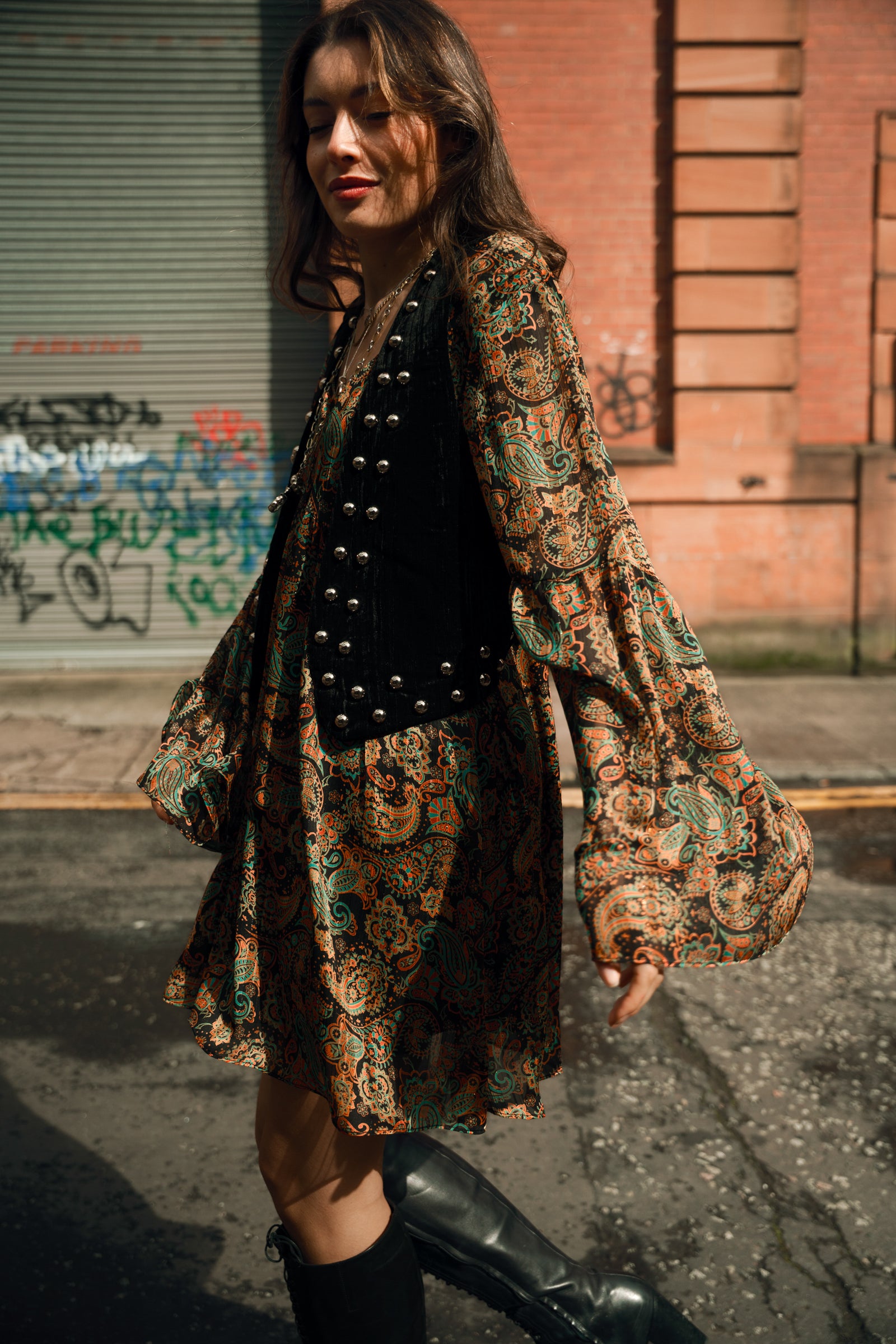 Bronwyn wearing the Lennon studded black waistcoat with the Ringo paisley Mini dress, glasgow street style.