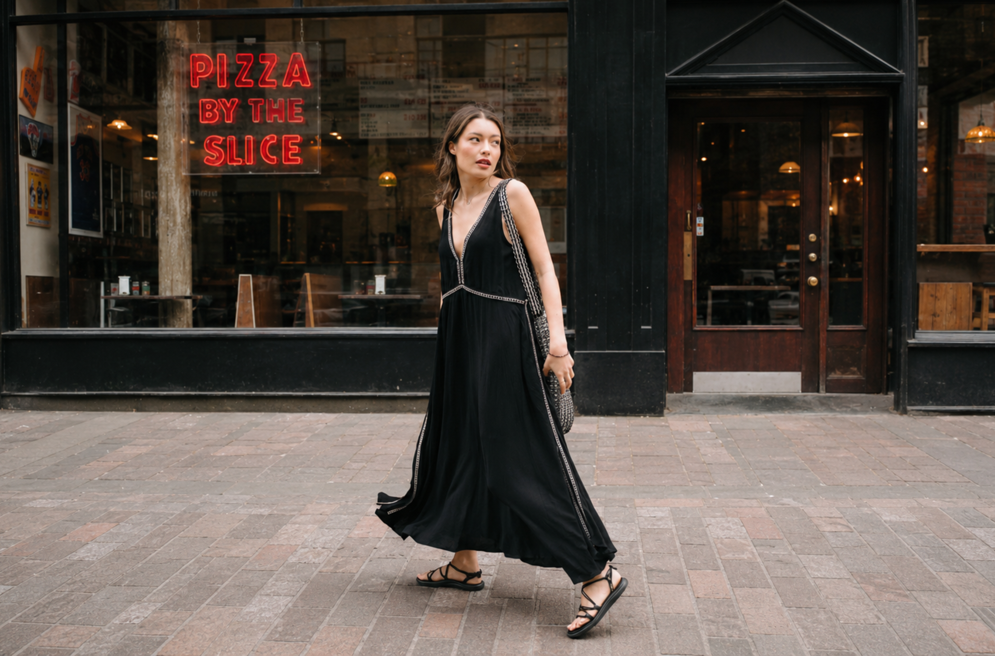 Little Lies Onyx Studded Midi Dress in black with silver stud trim and flowing volume on a city street