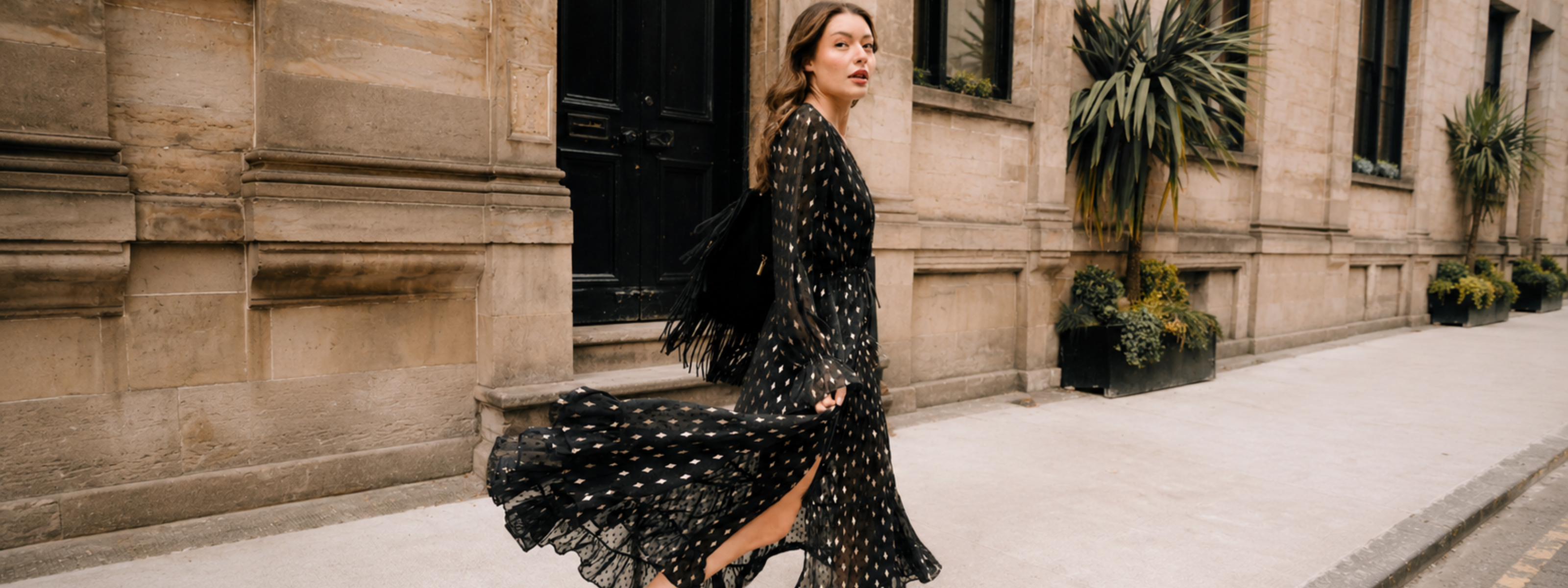 Little Lies Space Oddity Metallic Maxi Dress in sheer black chiffon with gold metallic diamond motifs, worn as a dress with tiered ruffle hem