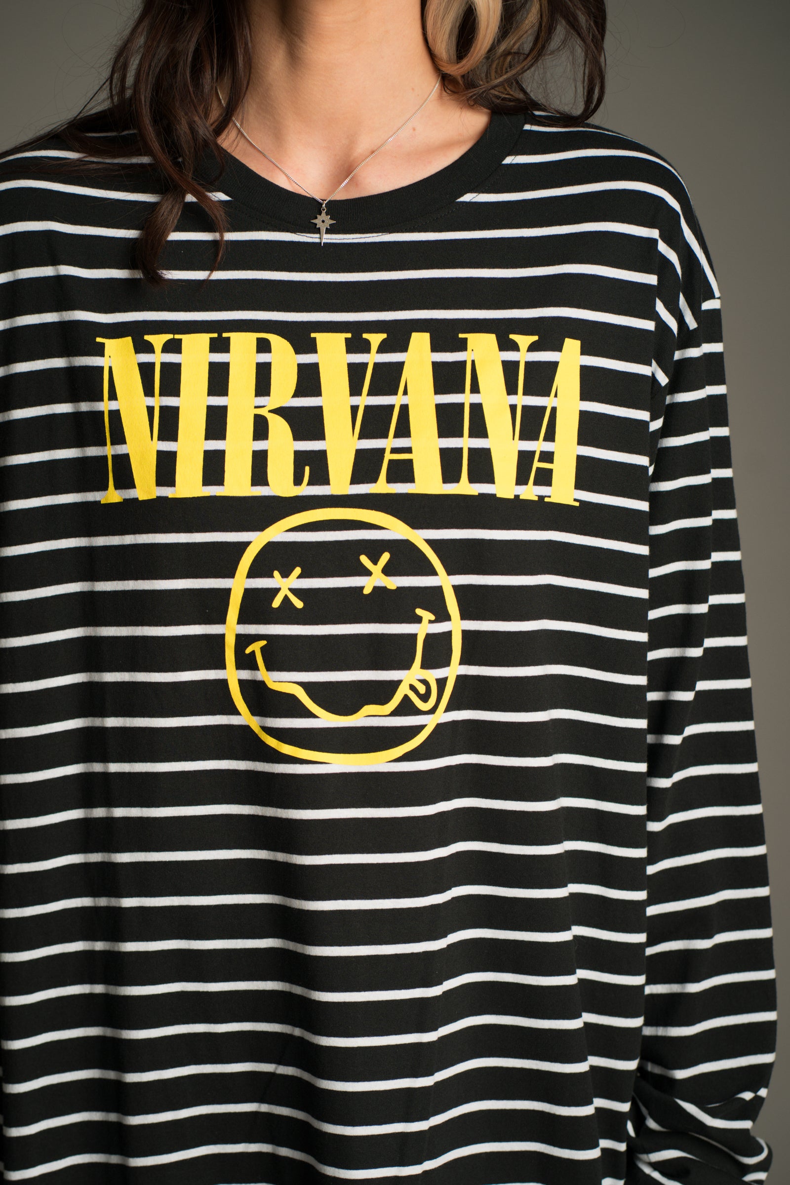 Nirvana smiley logo on striped long sleeve T-shirt