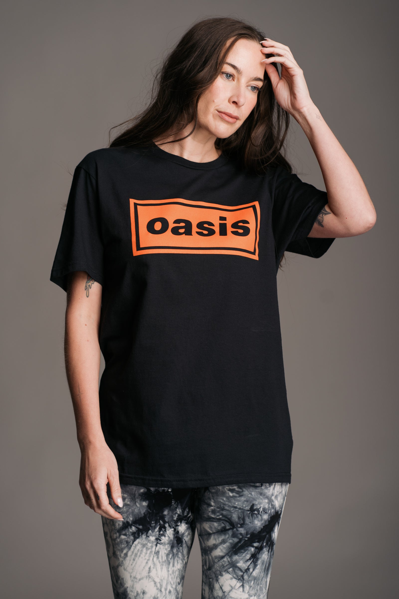 Front view of Oasis Access All Areas Band Tee showing tour pass graphic from Little Lies