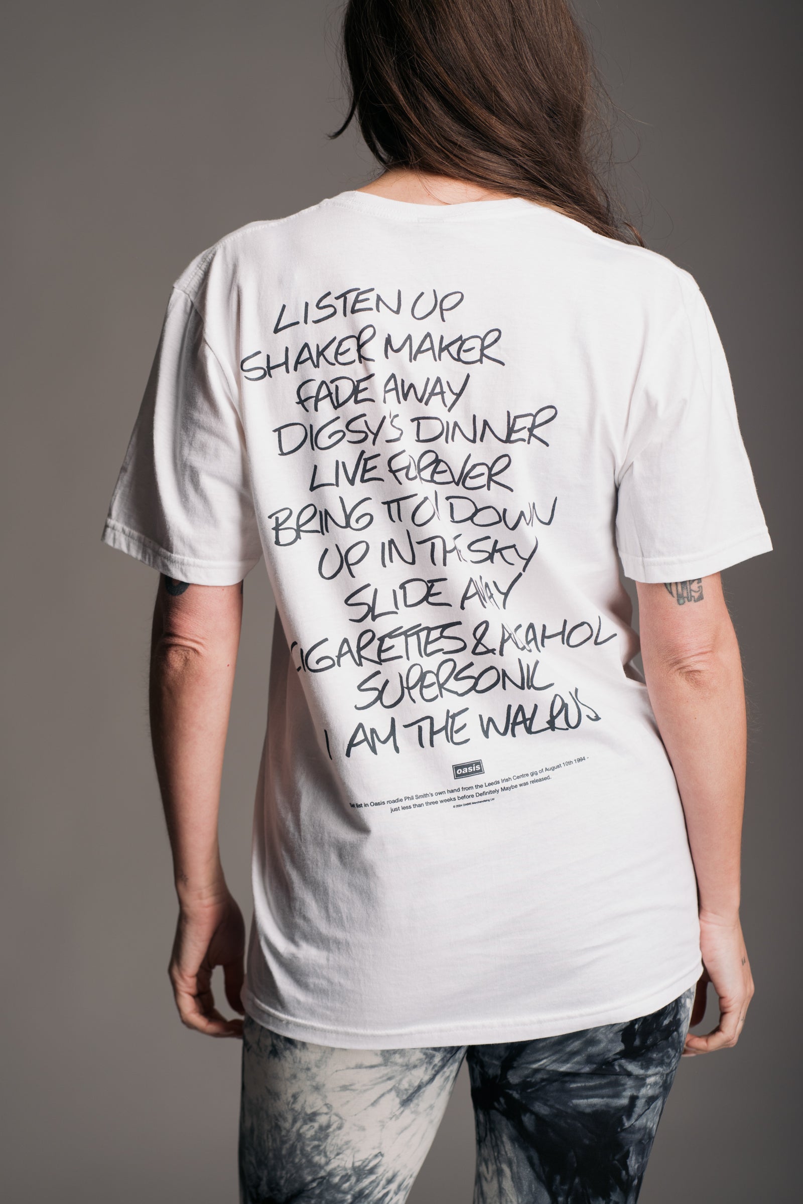 Back view of Oasis Setlist Band Tee showing full setlist print from Little Lies