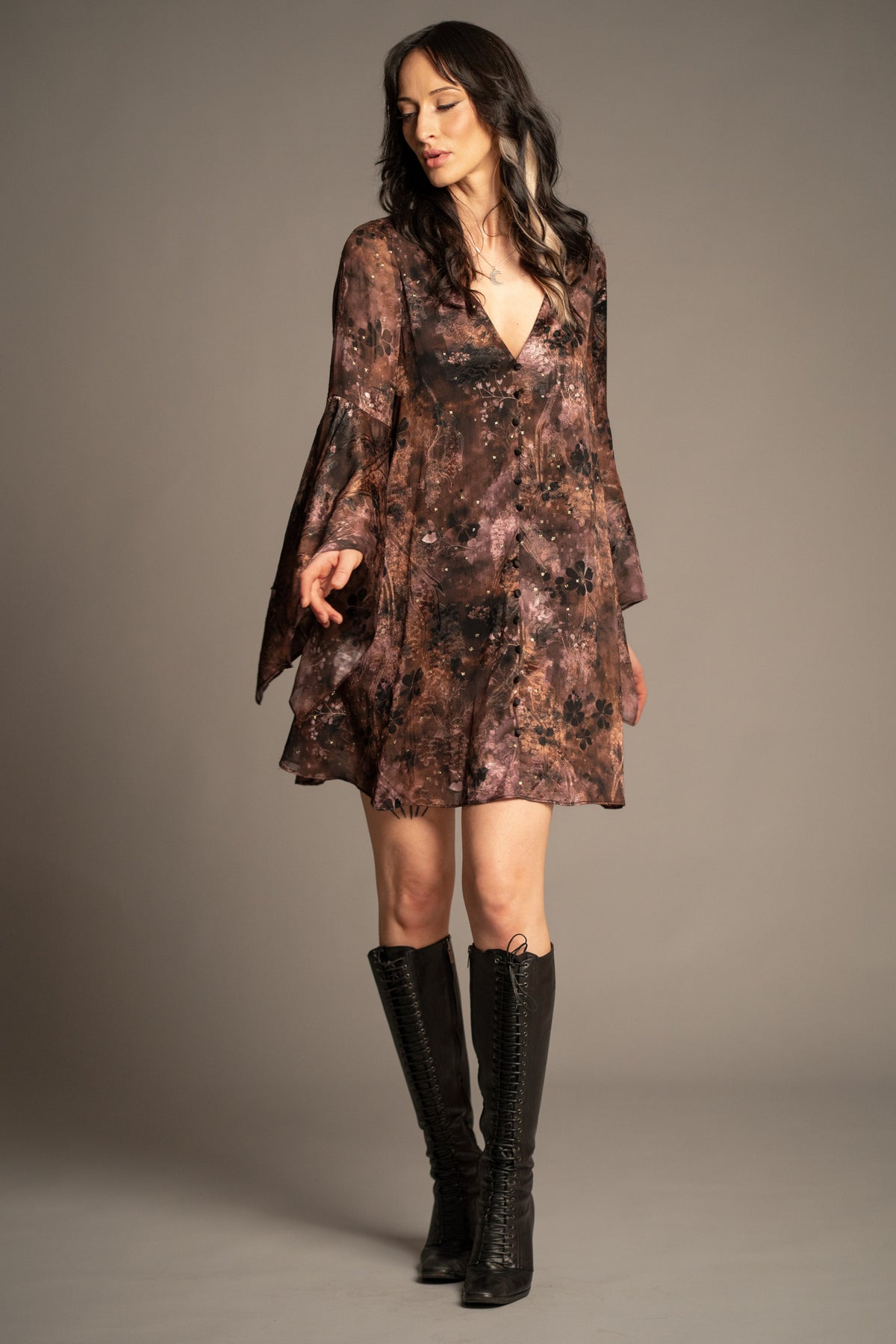 Practical Magic mini dress with vintage-inspired floral print, deep V-neckline and flowing hanky sleeves front view
