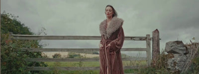 Little Lies Sienna Velvet Kimono Jacket in bronze velvet with a faux fur collar styled in a romantic countryside setting.