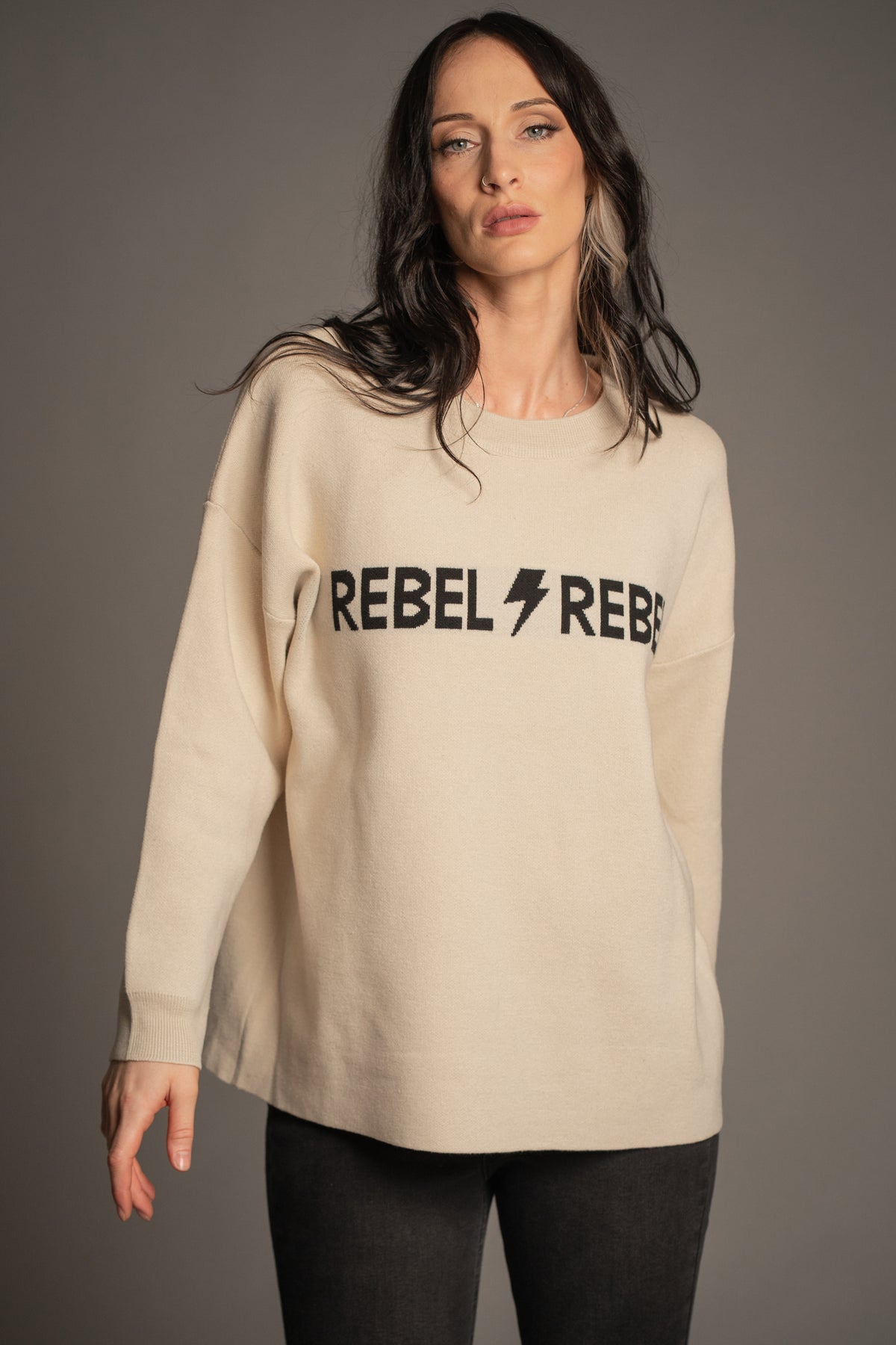 Victoria styling the Rebel Rebel Cream Knit Jumper with black Hendrix Denim Flares
