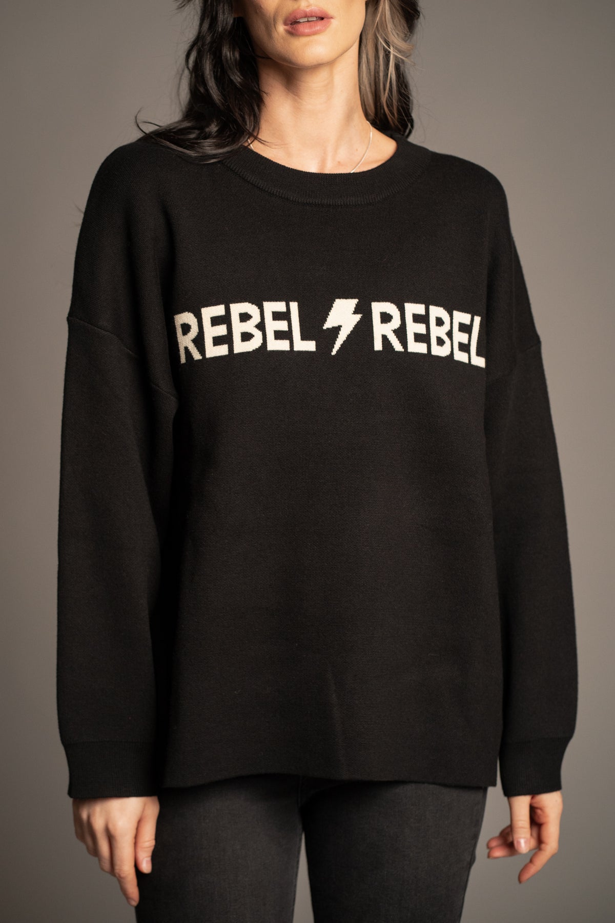 Rebel Rebel Graphic Knit Jumper — oversized black heavy knit with ivory Rebel Rebel slogan