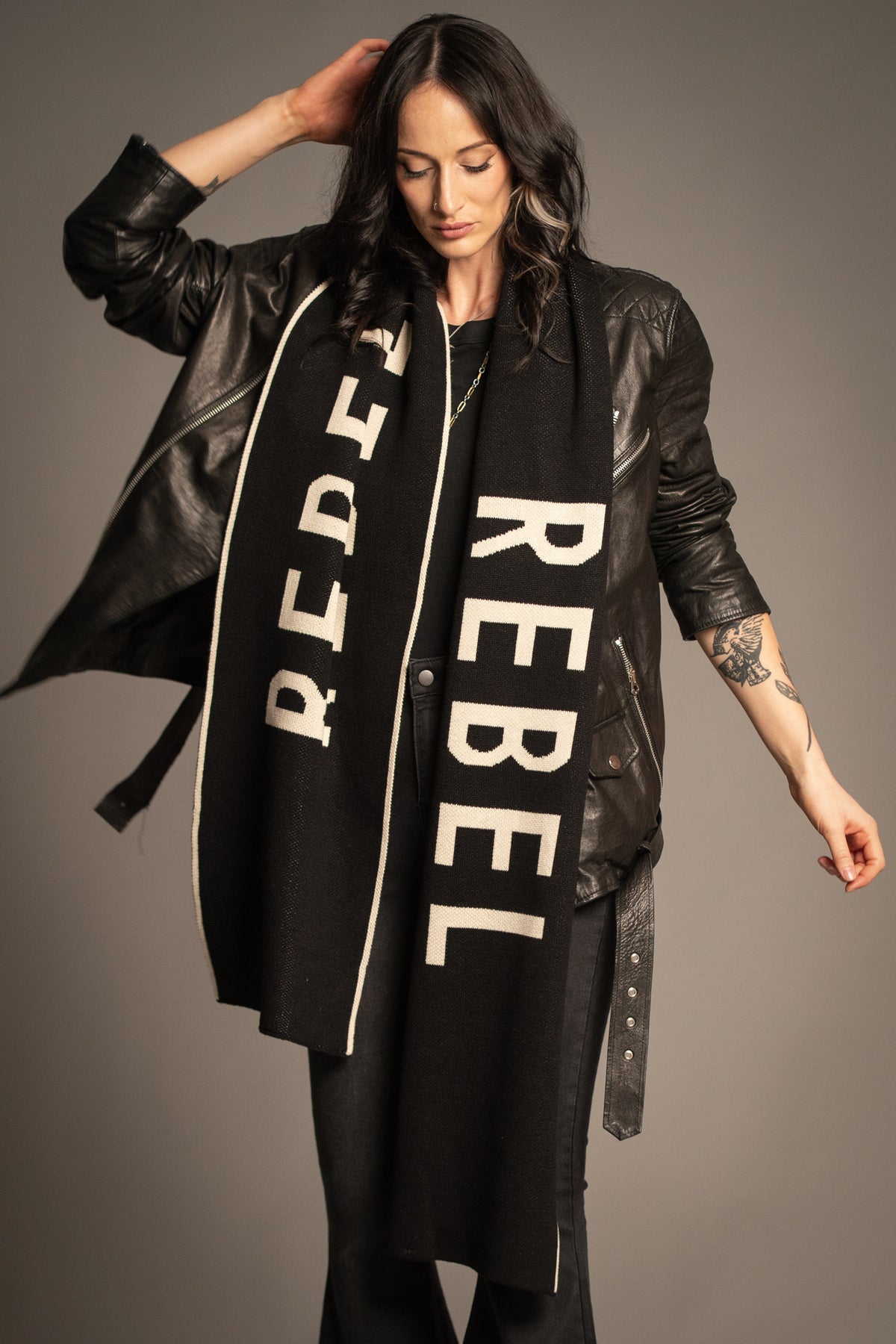 Little Lies Rebel Rebel Knit Scarf in black with oversized ivory Rebel slogan and contrast edge detailing
