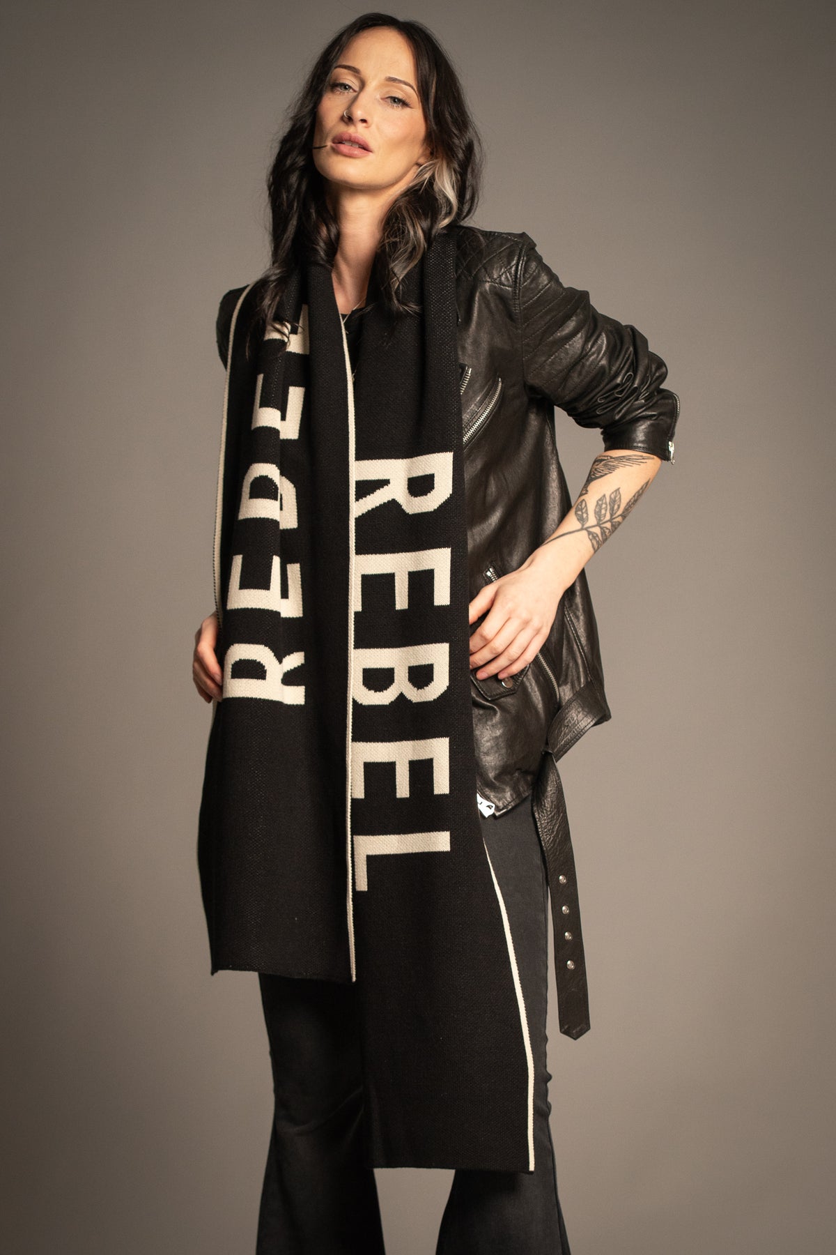 Little Lies Rebel Rebel Knit Scarf styled with a leather jacket for an effortless rock-inspired look