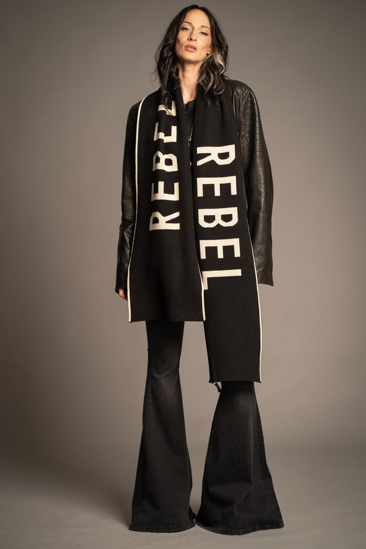 Little Lies Rebel Rebel Knit Scarf in black with oversized ivory Rebel slogan and contrast edge detailing